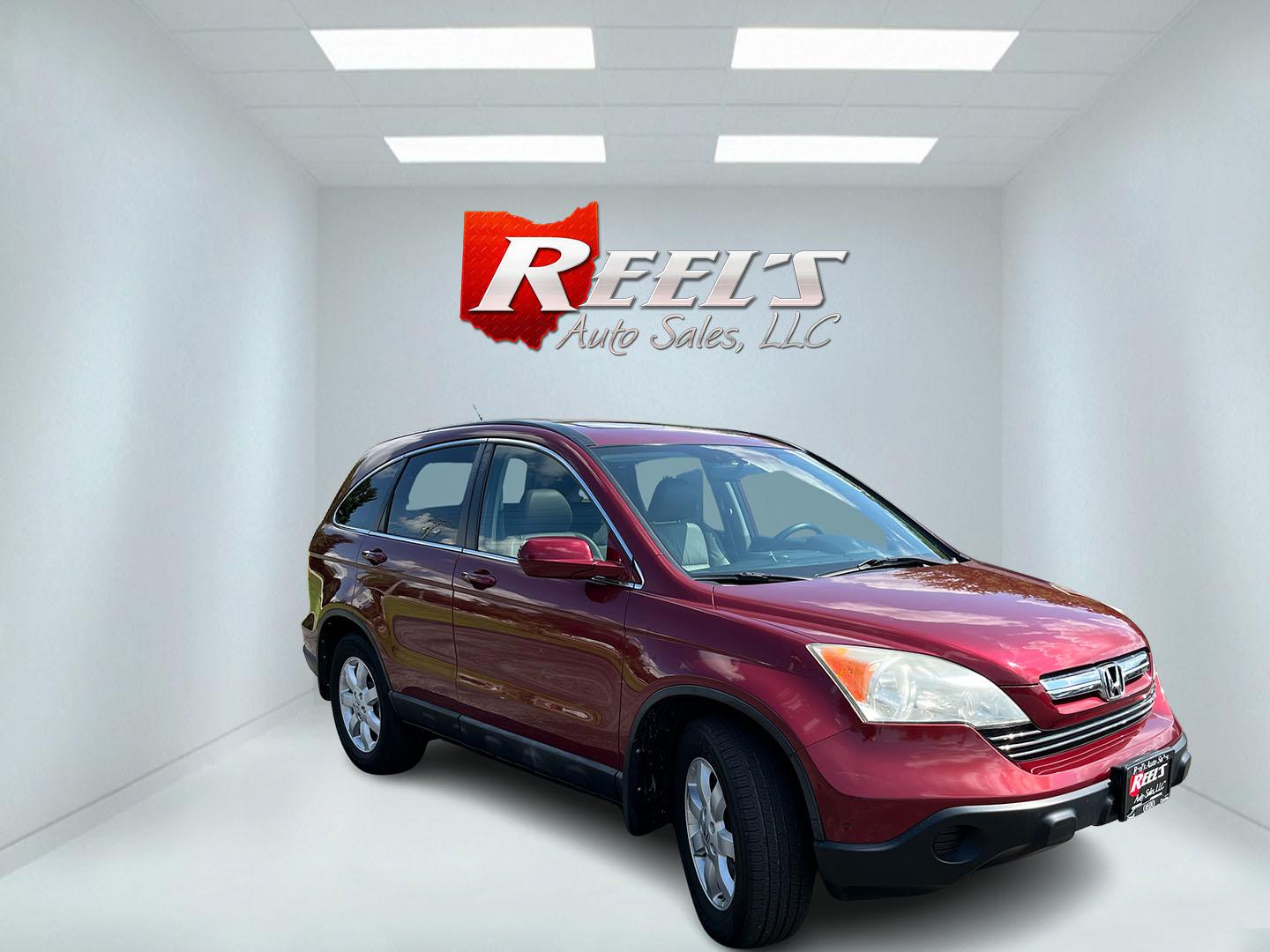 2009 Red /Gray Honda CR-V EX-L 4WD 5-Speed AT (5J6RE48749L) with an 2.4L I4 DOHC 16V engine, Automatic transmission, located at 11115 Chardon Rd. , Chardon, OH, 44024, (440) 214-9705, 41.580246, -81.241943- Photo#2