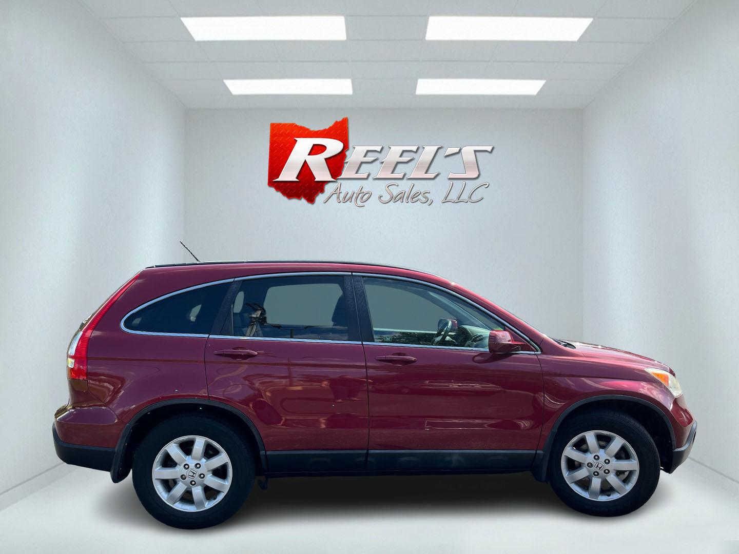 2009 Red /Gray Honda CR-V EX-L 4WD 5-Speed AT (5J6RE48749L) with an 2.4L I4 DOHC 16V engine, Automatic transmission, located at 11115 Chardon Rd. , Chardon, OH, 44024, (440) 214-9705, 41.580246, -81.241943- Photo#5