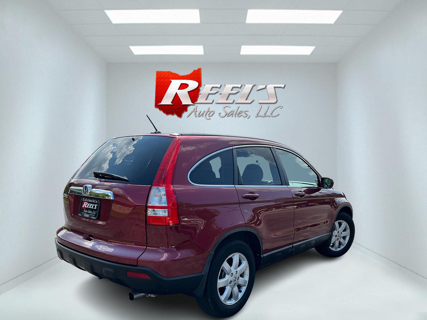 2009 Red /Gray Honda CR-V EX-L 4WD 5-Speed AT (5J6RE48749L) with an 2.4L I4 DOHC 16V engine, Automatic transmission, located at 11115 Chardon Rd. , Chardon, OH, 44024, (440) 214-9705, 41.580246, -81.241943- Photo#6
