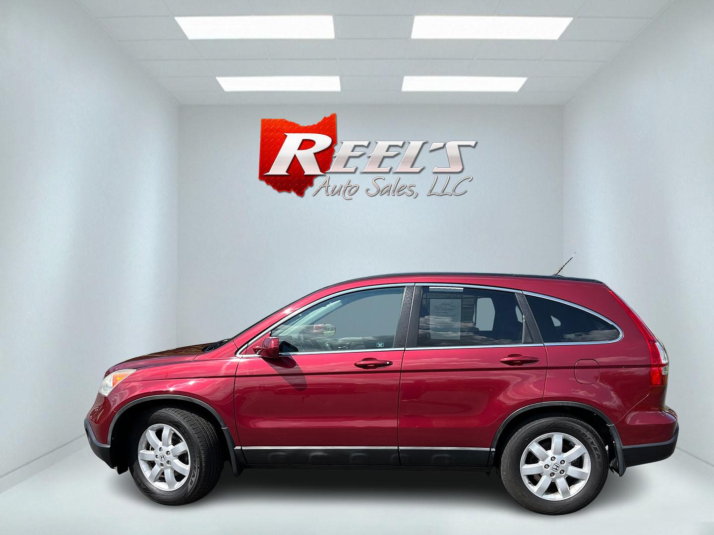 2009 Red /Gray Honda CR-V EX-L 4WD 5-Speed AT (5J6RE48749L) with an 2.4L I4 DOHC 16V engine, Automatic transmission, located at 11115 Chardon Rd. , Chardon, OH, 44024, (440) 214-9705, 41.580246, -81.241943- Photo#11