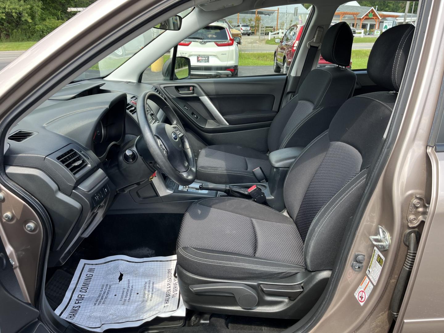 2015 Brown /Black Subaru Forester 2.5i (JF2SJAAC3FH) with an 2.5L H4 SOHC 16V engine, Automatic transmission, located at 11115 Chardon Rd. , Chardon, OH, 44024, (440) 214-9705, 41.580246, -81.241943 - 2015 Subaru Forester 2.5i PZEV – Practical AWD Capability with Strong Everyday Efficiency If you want a compact SUV that prioritizes confidence in changing conditions, this 2015 Subaru Forester 2.5i PZEV is a straightforward choice. The 2.5L engine pairs with Subaru’s full-time Symmetrical All-- Photo#16