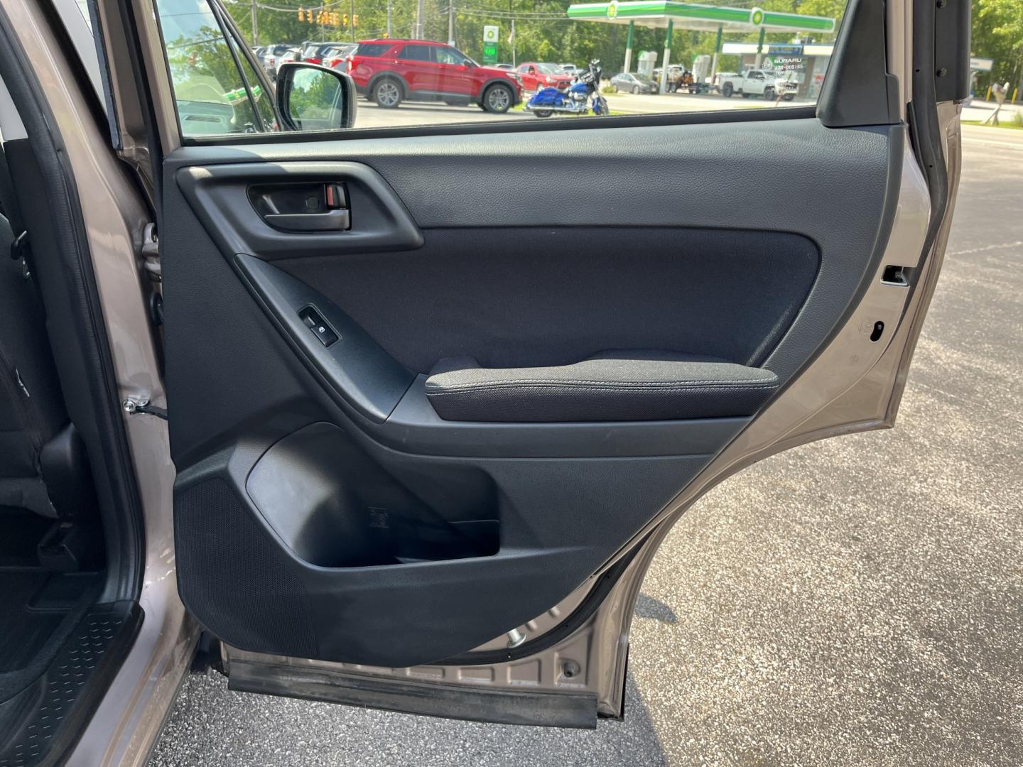 2015 Brown /Black Subaru Forester 2.5i (JF2SJAAC3FH) with an 2.5L H4 SOHC 16V engine, Automatic transmission, located at 11115 Chardon Rd. , Chardon, OH, 44024, (440) 214-9705, 41.580246, -81.241943 - 2015 Subaru Forester 2.5i PZEV – Practical AWD Capability with Strong Everyday Efficiency If you want a compact SUV that prioritizes confidence in changing conditions, this 2015 Subaru Forester 2.5i PZEV is a straightforward choice. The 2.5L engine pairs with Subaru’s full-time Symmetrical All-- Photo#28