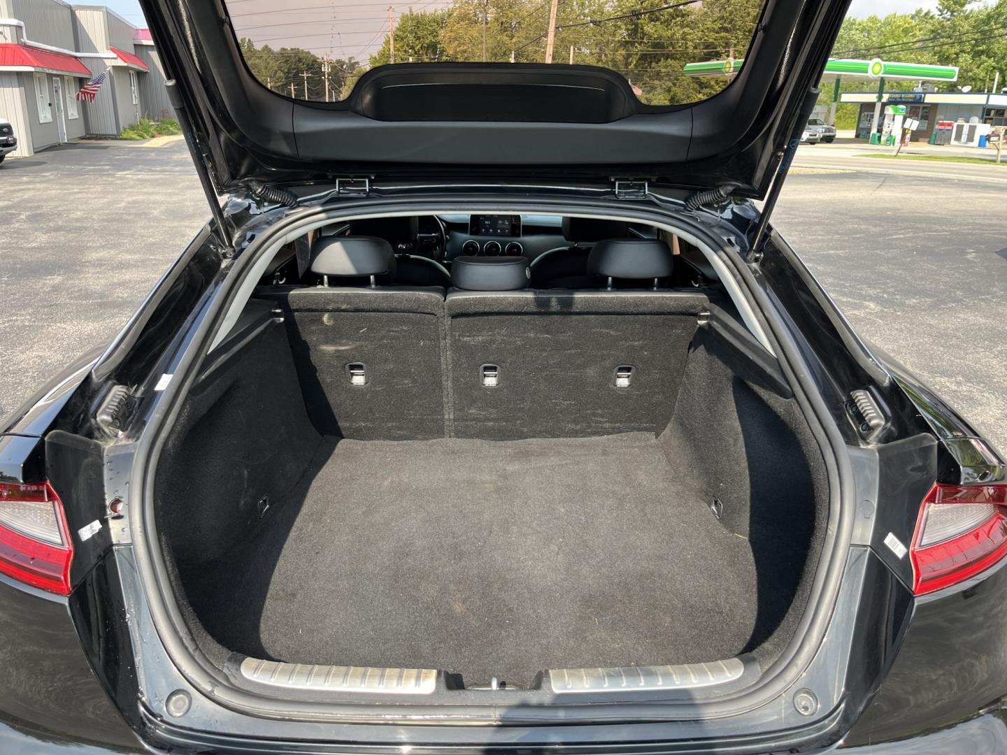 2018 Black /Black Kia Stinger Base RWD (KNAE15LA7J6) with an 2.0L I4 DOHC 16V Turbo engine, Automatic transmission, located at 11115 Chardon Rd. , Chardon, OH, 44024, (440) 214-9705, 41.580246, -81.241943 - 2018 Kia Stinger RWD – A Sporty Fastback with Everyday Usability If you want a sedan that feels more engaging than a typical commuter car, this 2018 Kia Stinger RWD is a strong option. The 2.0L Twin-Scroll Turbo I4 and 8-speed automatic deliver responsive power, while selectable driving modes let- Photo#14