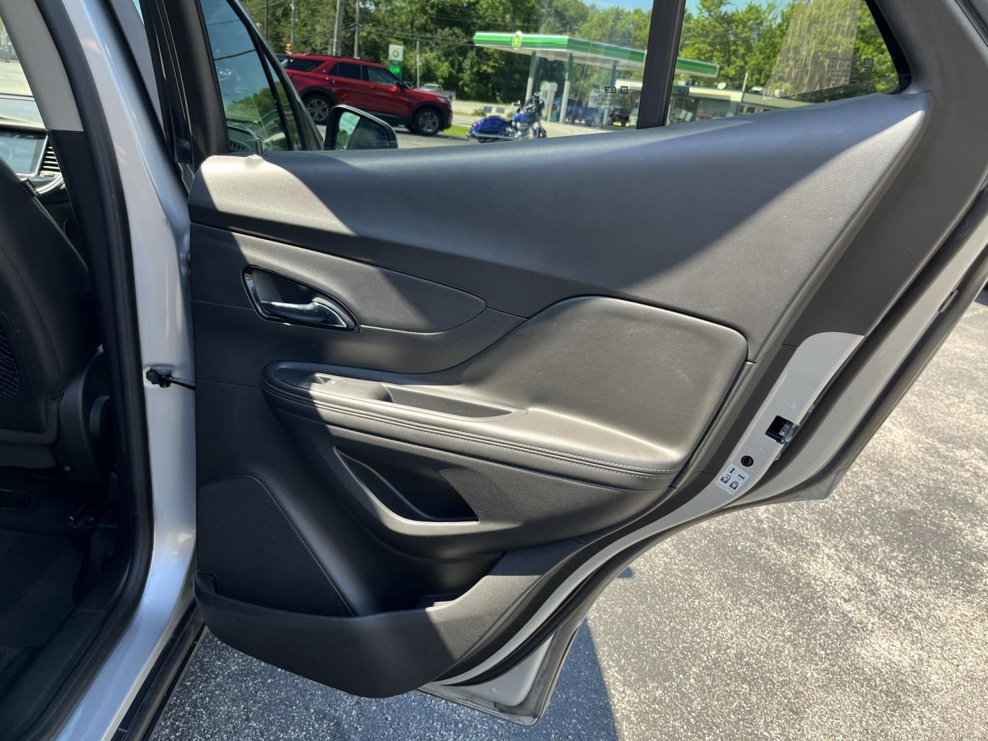 2018 Silver /Black Buick Encore Sport Touring AWD (KL4CJ2SB5JB) with an 1.4L I4 DOHC 16V TURBO engine, Automatic transmission, located at 11115 Chardon Rd. , Chardon, OH, 44024, (440) 214-9705, 41.580246, -81.241943 - 2018 Buick Encore Sport Touring AWD – Compact Efficiency with a More Refined Feel If you want a smaller crossover that still feels a step up in comfort and style, this 2018 Buick Encore Sport Touring AWD is a solid option. The 1.4L Turbocharged EcoTec engine and 6-speed automatic deliver responsi- Photo#29