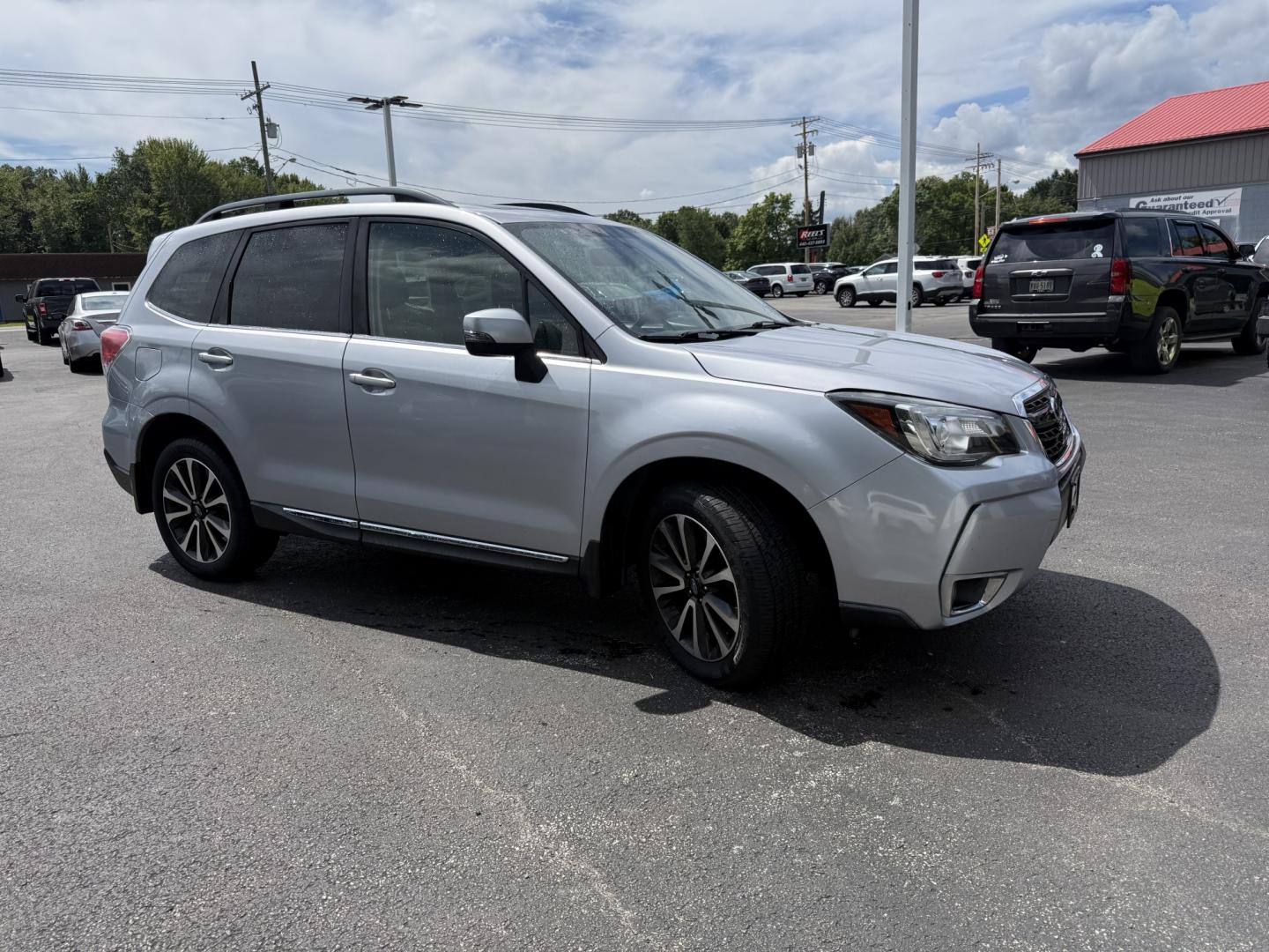 2017 Silver /Black Subaru Forester 2.0XT Touring (JF2SJGWC9HH) with an 2.0L H4 DOHC 16V Turbo engine, Automatic transmission, located at 547 E. Main St., Orwell, OH, 44076, (440) 437-5893, 41.535435, -80.847855 - 2017 Subaru Forester XT Touring – Turbo Power with Premium Comfort and All-Weather Confidence If you want a compact SUV that feels quicker than the typical Forester and still ready for changing conditions, this 2017 Subaru Forester XT Touring is a strong choice. The 2.0L turbocharged engine deliv- Photo#3