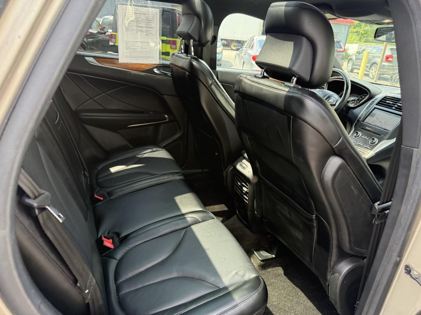 2015 Tan /Black Lincoln MKC Reserve AWD (5LMTJ2AHXFU) with an 2.3L I4 DOHC 16V Turbo engine, Automatic transmission, located at 547 E. Main St., Orwell, OH, 44076, (440) 437-5893, 41.535435, -80.847855 - 2015 Lincoln MKC Reserve AWD – Compact Luxury with Comfort and Everyday Convenience If you want a smaller luxury SUV that still feels well appointed, this 2015 Lincoln MKC Reserve AWD is a strong option. The 2.3L EcoBoost engine and 6-speed automatic deliver responsive power with available AWD fo- Photo#40