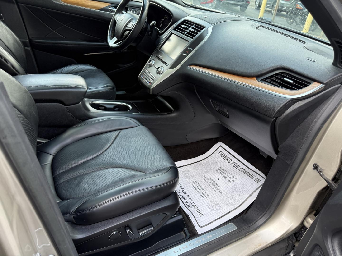 2015 Tan /Black Lincoln MKC Reserve AWD (5LMTJ2AHXFU) with an 2.3L I4 DOHC 16V Turbo engine, Automatic transmission, located at 547 E. Main St., Orwell, OH, 44076, (440) 437-5893, 41.535435, -80.847855 - 2015 Lincoln MKC Reserve AWD – Compact Luxury with Comfort and Everyday Convenience If you want a smaller luxury SUV that still feels well appointed, this 2015 Lincoln MKC Reserve AWD is a strong option. The 2.3L EcoBoost engine and 6-speed automatic deliver responsive power with available AWD fo- Photo#42