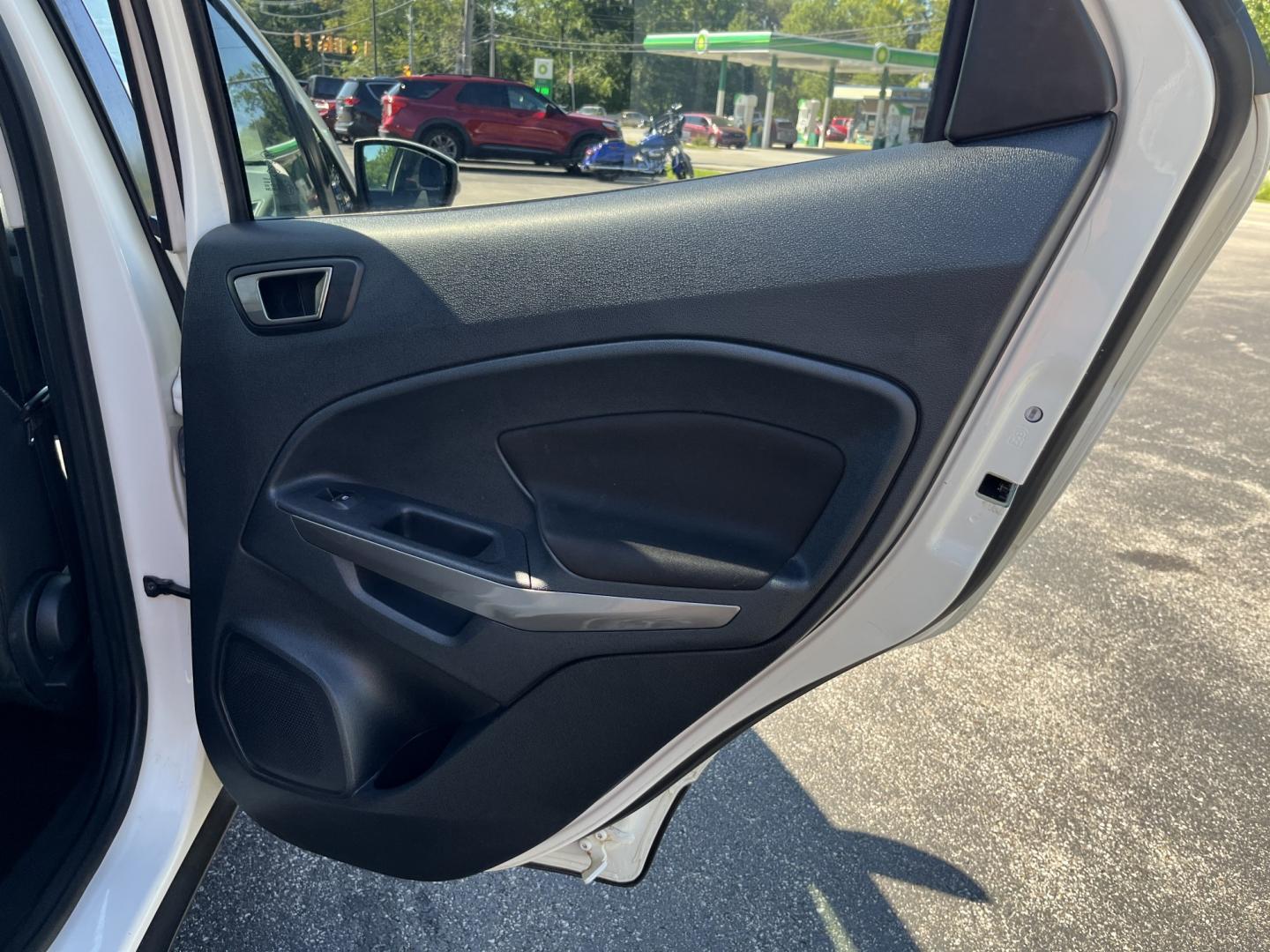 2021 White /Black Ford EcoSport SE AWD (MAJ6S3GL1MC) with an 2.0L I4 DOHC 16V engine, Automatic transmission, located at 11115 Chardon Rd. , Chardon, OH, 44024, (440) 214-9705, 41.580246, -81.241943 - 2021 Ford EcoSport SE 4WD – Compact Size with All-Weather Capability and Everyday Convenience If you want a smaller SUV that is easy to park and still useful in changing conditions, this 2021 Ford EcoSport SE 4WD is a practical choice. The 2.0L Duratec engine and 6-speed automatic deliver smooth- Photo#34