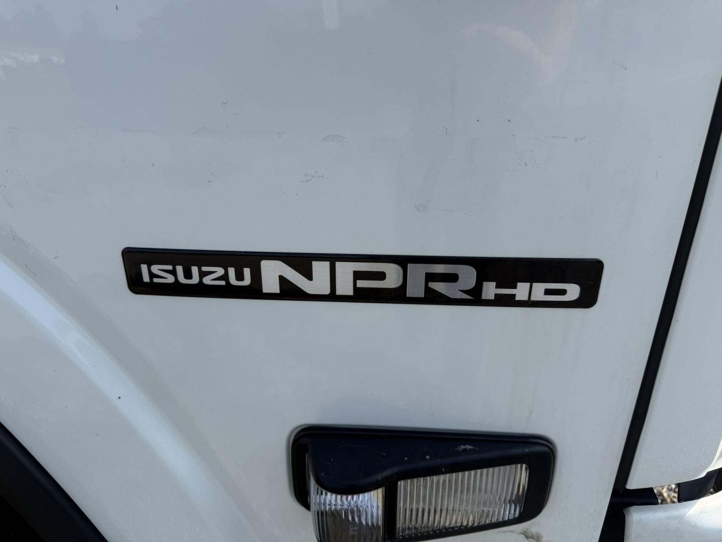 2019 White /Gray Isuzu NPR HD - (54DC4W1B4KS) with an 6.0L V8 OHV 16V engine, Automatic transmission, located at 547 E. Main St., Orwell, OH, 44076, (440) 437-5893, 41.535435, -80.847855 - 2019 Isuzu NPR HD Box Truck – Straightforward Work Truck with One-Owner History If you need a dependable box truck for deliveries or job-site use, this 2019 Isuzu NPR HD is a practical option. The 6.0L Vortec V8 and 6-speed automatic deliver the power and durability expected in a commercial truck- Photo#5