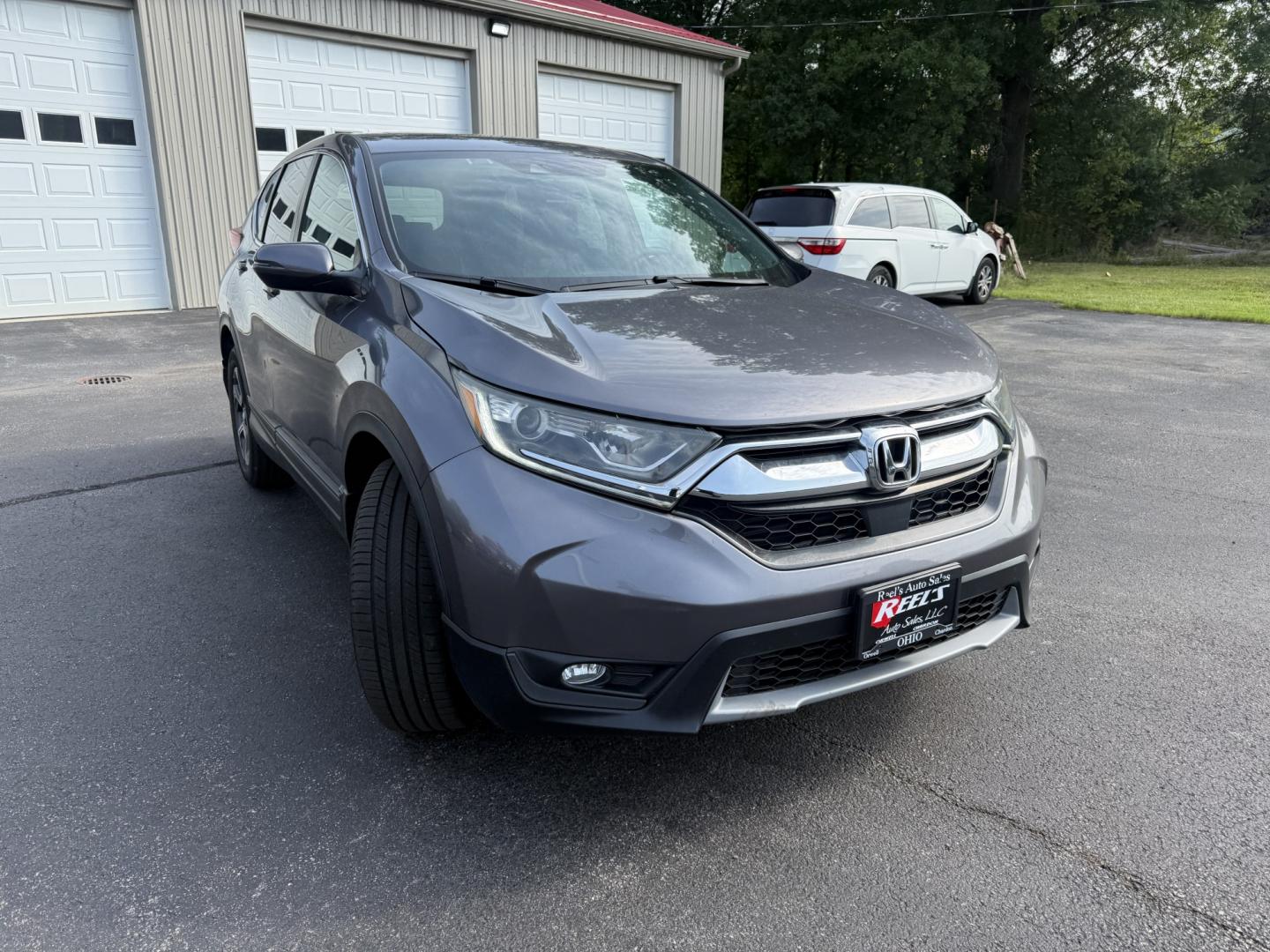 2018 Gray /Black Honda CR-V EX AWD (7FARW2H5XJE) with an 1.5L I4 16V DOHC TURBO engine, Automatic transmission, located at 547 E. Main St., Orwell, OH, 44076, (440) 437-5893, 41.535435, -80.847855 - 2018 Honda CR-V EX AWD – Efficient Compact SUV with One-Owner History and Everyday Comfort If you want a compact SUV that balances efficiency, comfort, and all-weather capability, this 2018 Honda CR-V EX AWD is a strong option. The 1.5L Turbocharged engine delivers responsive power and a solid 33- Photo#2