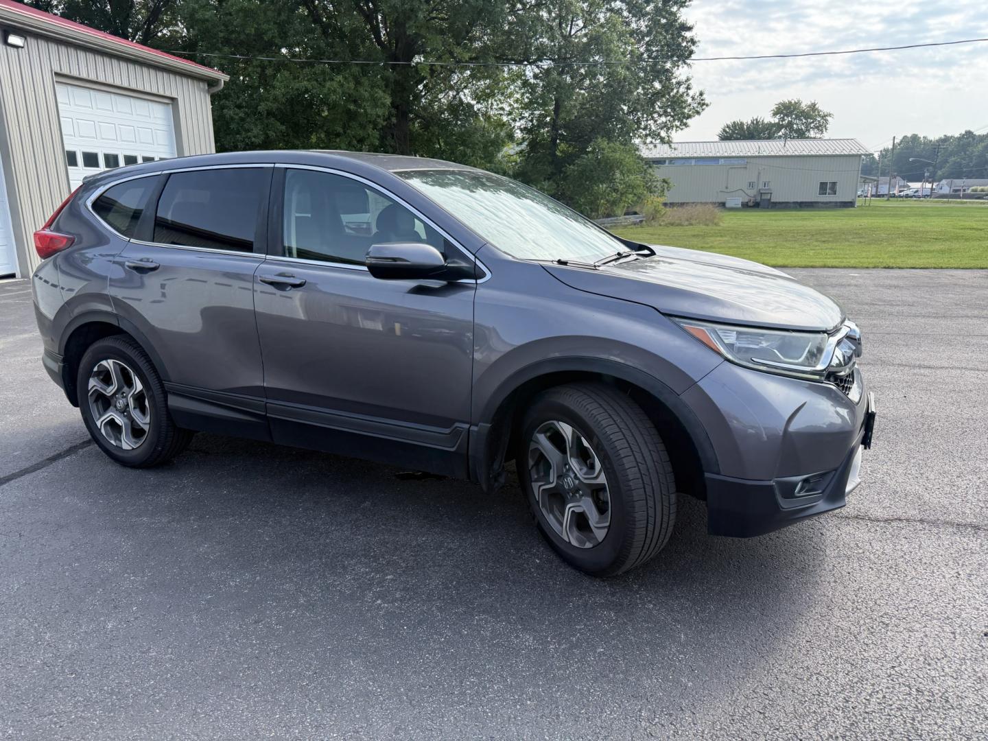 2018 Gray /Black Honda CR-V EX AWD (7FARW2H5XJE) with an 1.5L I4 16V DOHC TURBO engine, Automatic transmission, located at 547 E. Main St., Orwell, OH, 44076, (440) 437-5893, 41.535435, -80.847855 - 2018 Honda CR-V EX AWD – Efficient Compact SUV with One-Owner History and Everyday Comfort If you want a compact SUV that balances efficiency, comfort, and all-weather capability, this 2018 Honda CR-V EX AWD is a strong option. The 1.5L Turbocharged engine delivers responsive power and a solid 33- Photo#3
