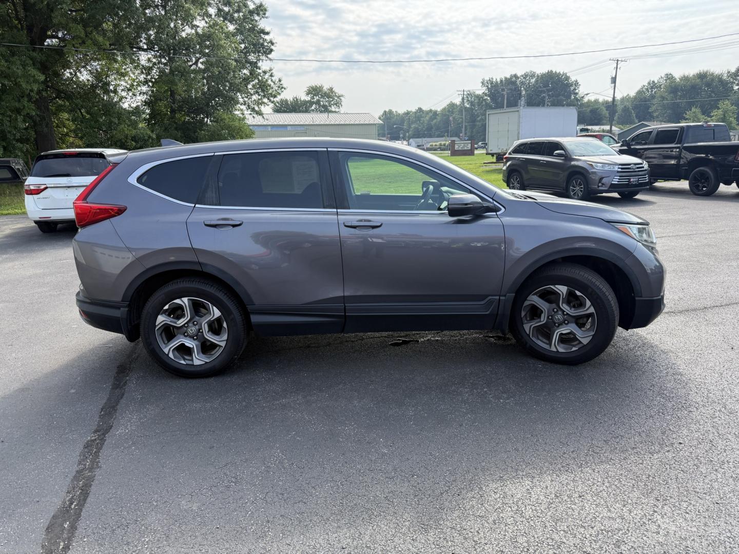 2018 Gray /Black Honda CR-V EX AWD (7FARW2H5XJE) with an 1.5L I4 16V DOHC TURBO engine, Automatic transmission, located at 547 E. Main St., Orwell, OH, 44076, (440) 437-5893, 41.535435, -80.847855 - 2018 Honda CR-V EX AWD – Efficient Compact SUV with One-Owner History and Everyday Comfort If you want a compact SUV that balances efficiency, comfort, and all-weather capability, this 2018 Honda CR-V EX AWD is a strong option. The 1.5L Turbocharged engine delivers responsive power and a solid 33- Photo#24