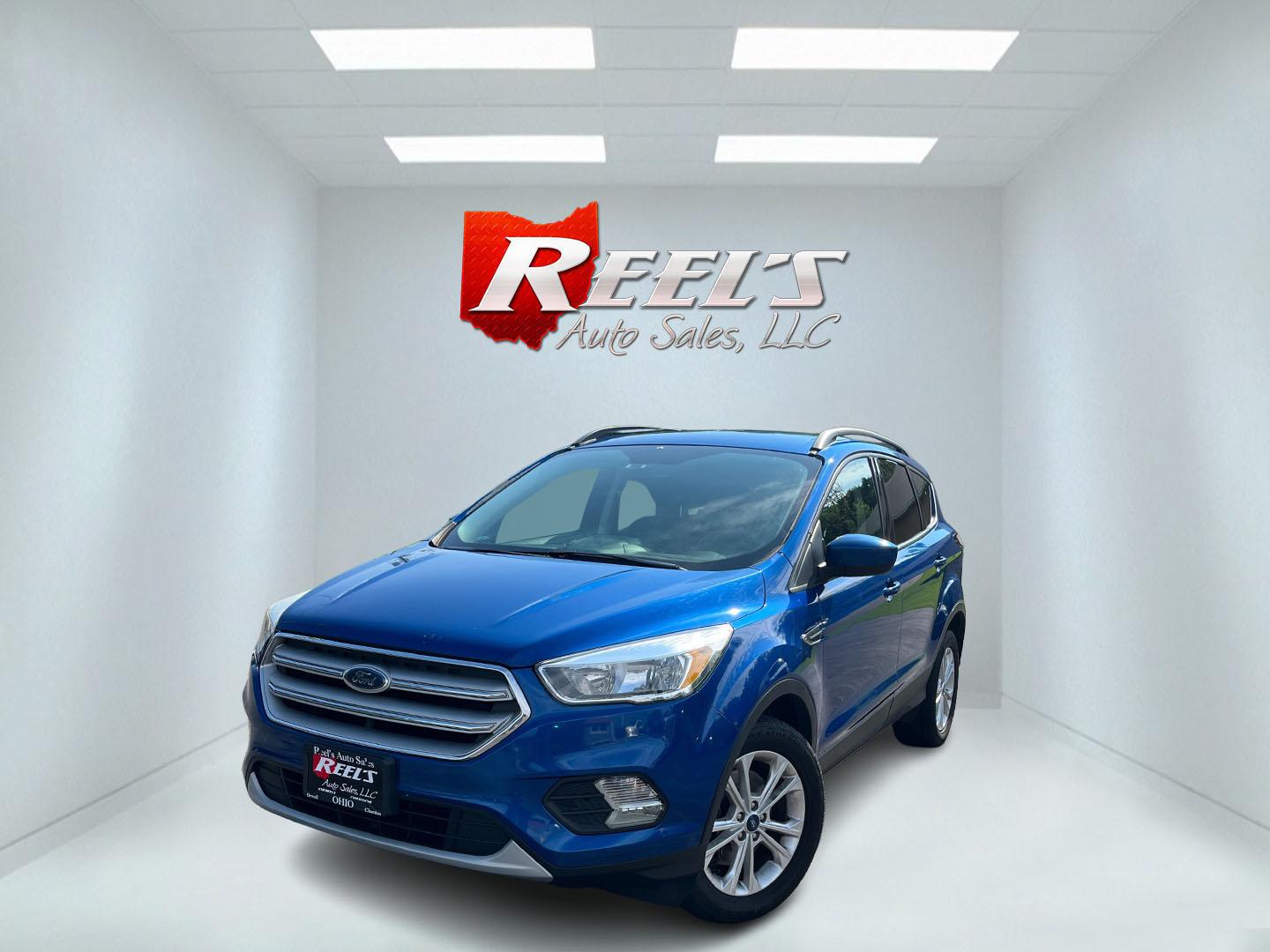2018 Blue /Black Ford Escape SE 4WD (1FMCU9GD0JU) with an 1.5L I4 DOHC 16V Turbo engine, Automatic transmission, located at 547 E. Main St., Orwell, OH, 44076, (440) 437-5893, 41.535435, -80.847855 - 2018 Ford Escape SE 4WD – Efficient Compact SUV with Everyday Comfort and One-Owner History If you want a compact SUV that is easy to live with and ready for changing weather, this 2018 Ford Escape SE 4WD is a practical choice. The 1.5L Turbocharged EcoBoost engine and 6-speed automatic deliver r- Photo#0