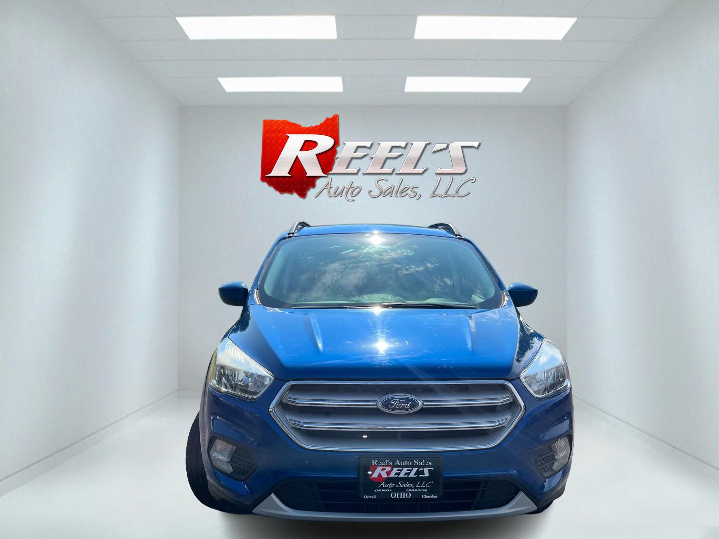 2018 Blue /Black Ford Escape SE 4WD (1FMCU9GD0JU) with an 1.5L I4 DOHC 16V Turbo engine, Automatic transmission, located at 547 E. Main St., Orwell, OH, 44076, (440) 437-5893, 41.535435, -80.847855 - 2018 Ford Escape SE 4WD – Efficient Compact SUV with Everyday Comfort and One-Owner History If you want a compact SUV that is easy to live with and ready for changing weather, this 2018 Ford Escape SE 4WD is a practical choice. The 1.5L Turbocharged EcoBoost engine and 6-speed automatic deliver r- Photo#2