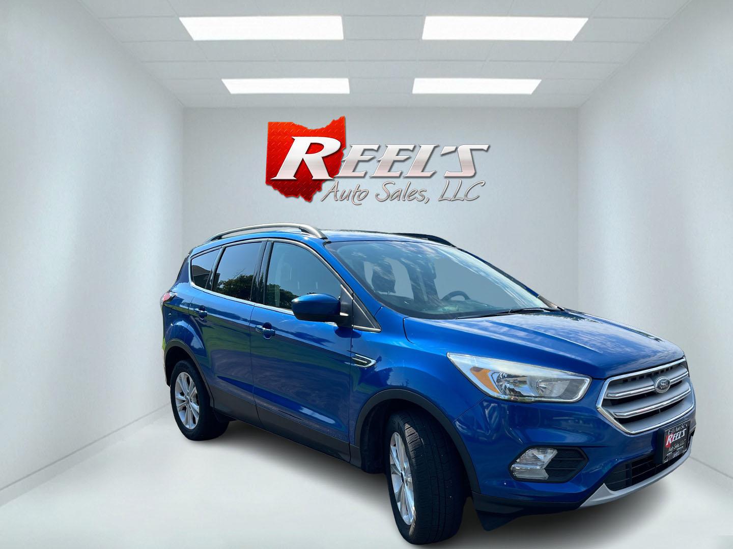 2018 Blue /Black Ford Escape SE 4WD (1FMCU9GD0JU) with an 1.5L I4 DOHC 16V Turbo engine, Automatic transmission, located at 547 E. Main St., Orwell, OH, 44076, (440) 437-5893, 41.535435, -80.847855 - 2018 Ford Escape SE 4WD – Efficient Compact SUV with Everyday Comfort and One-Owner History If you want a compact SUV that is easy to live with and ready for changing weather, this 2018 Ford Escape SE 4WD is a practical choice. The 1.5L Turbocharged EcoBoost engine and 6-speed automatic deliver r- Photo#3