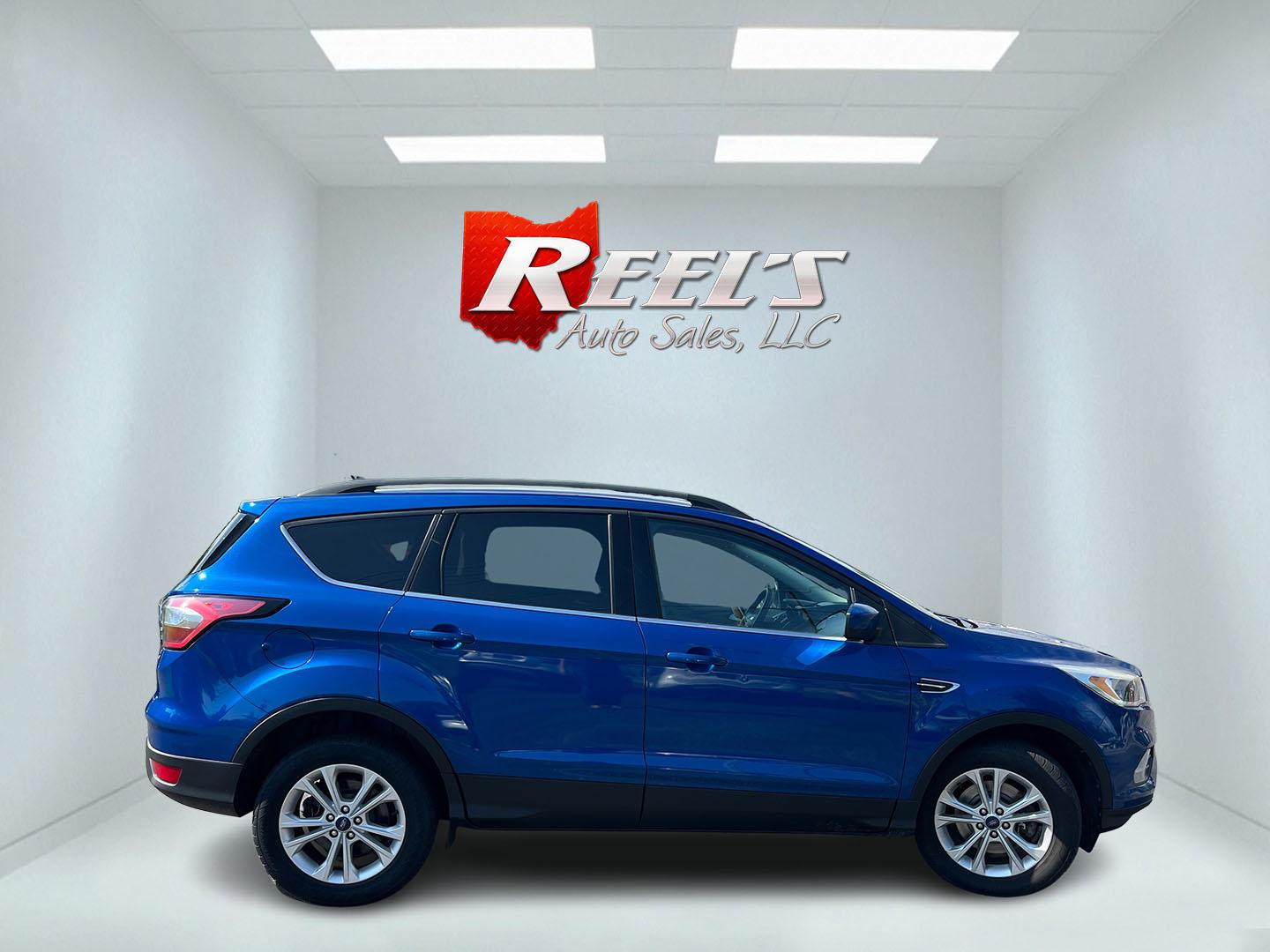 2018 Blue /Black Ford Escape SE 4WD (1FMCU9GD0JU) with an 1.5L I4 DOHC 16V Turbo engine, Automatic transmission, located at 547 E. Main St., Orwell, OH, 44076, (440) 437-5893, 41.535435, -80.847855 - 2018 Ford Escape SE 4WD – Efficient Compact SUV with Everyday Comfort and One-Owner History If you want a compact SUV that is easy to live with and ready for changing weather, this 2018 Ford Escape SE 4WD is a practical choice. The 1.5L Turbocharged EcoBoost engine and 6-speed automatic deliver r- Photo#6