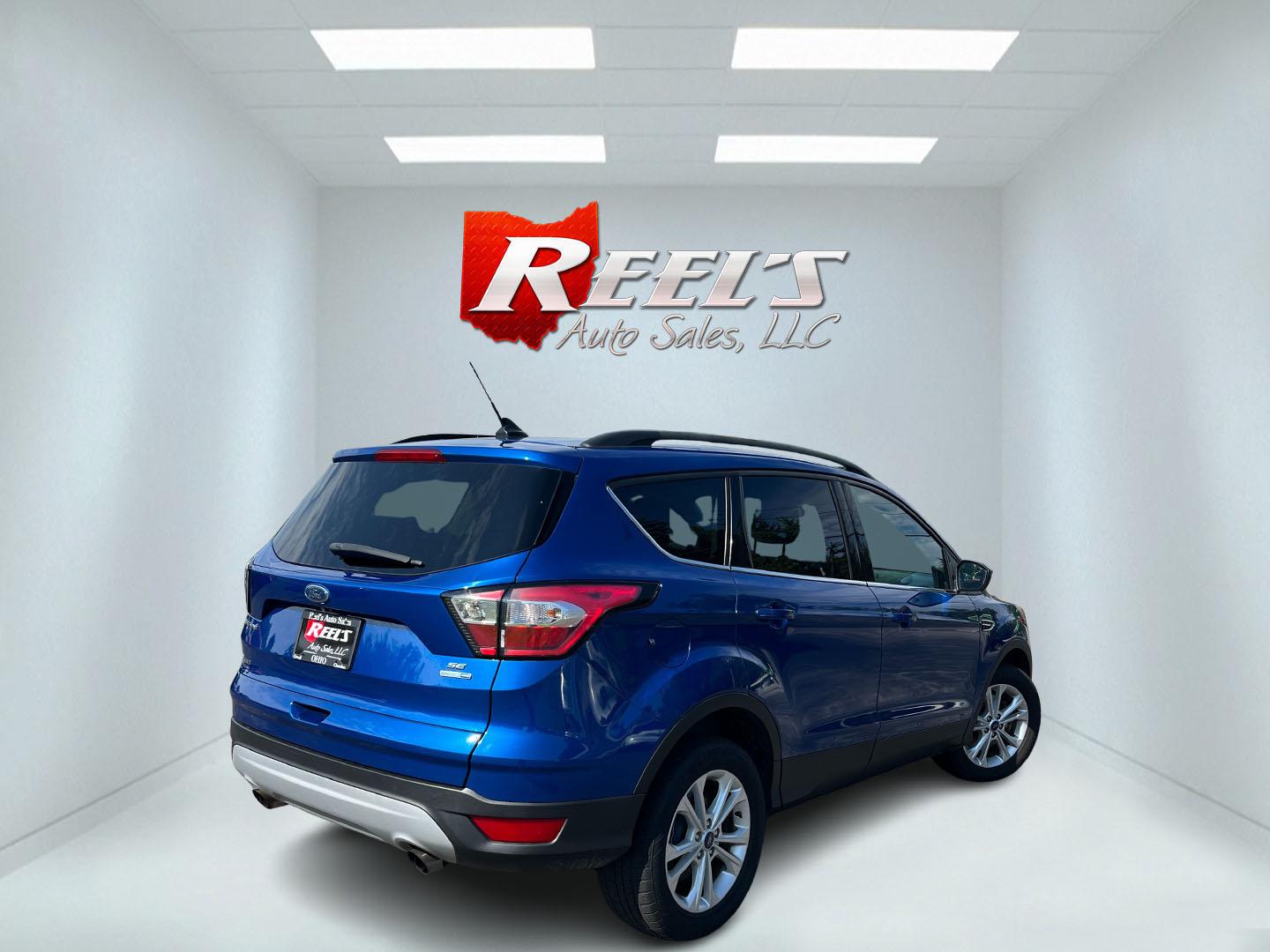 2018 Blue /Black Ford Escape SE 4WD (1FMCU9GD0JU) with an 1.5L I4 DOHC 16V Turbo engine, Automatic transmission, located at 547 E. Main St., Orwell, OH, 44076, (440) 437-5893, 41.535435, -80.847855 - 2018 Ford Escape SE 4WD – Efficient Compact SUV with Everyday Comfort and One-Owner History If you want a compact SUV that is easy to live with and ready for changing weather, this 2018 Ford Escape SE 4WD is a practical choice. The 1.5L Turbocharged EcoBoost engine and 6-speed automatic deliver r- Photo#7