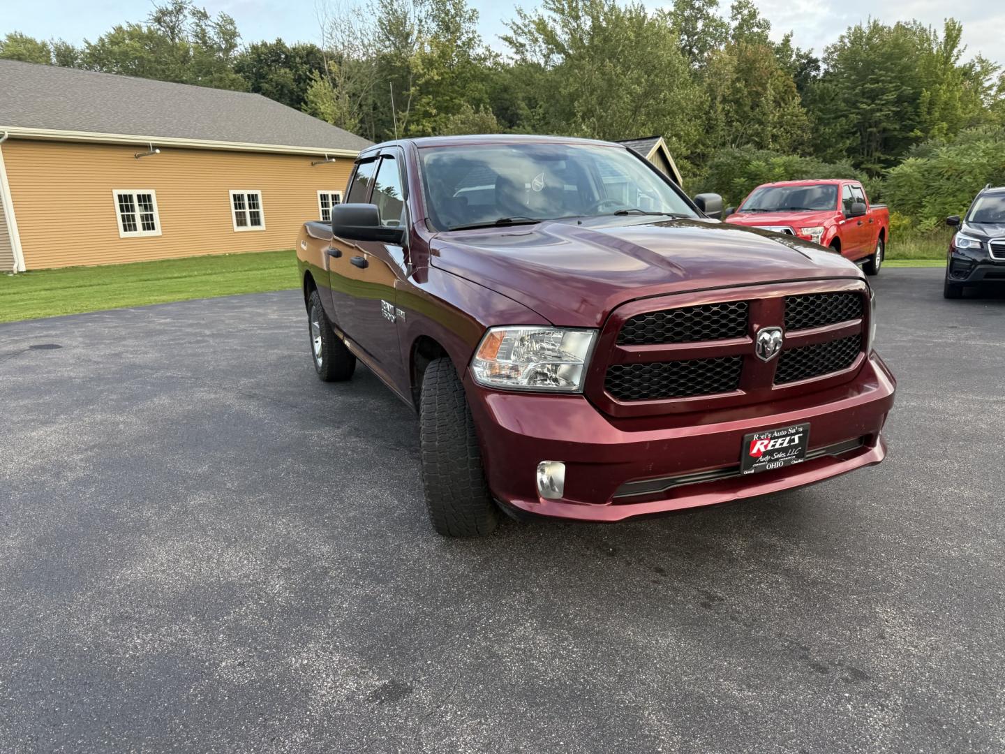 2016 Red /Black RAM 1500 Express Quad Cab 4WD (1C6RR7FT7GS) with an 5.7L V8 OHV 16V engine, Automatic transmission, located at 11115 Chardon Rd. , Chardon, OH, 44024, (440) 214-9705, 41.580246, -81.241943 - 2016 Ram 1500 Express Quad Cab 4WD – HEMI Power with Fresh Brakes and Solid Towing Capability If you need a full-size truck that is straightforward, capable, and ready to work, this 2016 Ram 1500 Express Quad Cab 4WD is a strong option. The 5.7L HEMI V8 and 8-speed automatic deliver dependable po- Photo#2