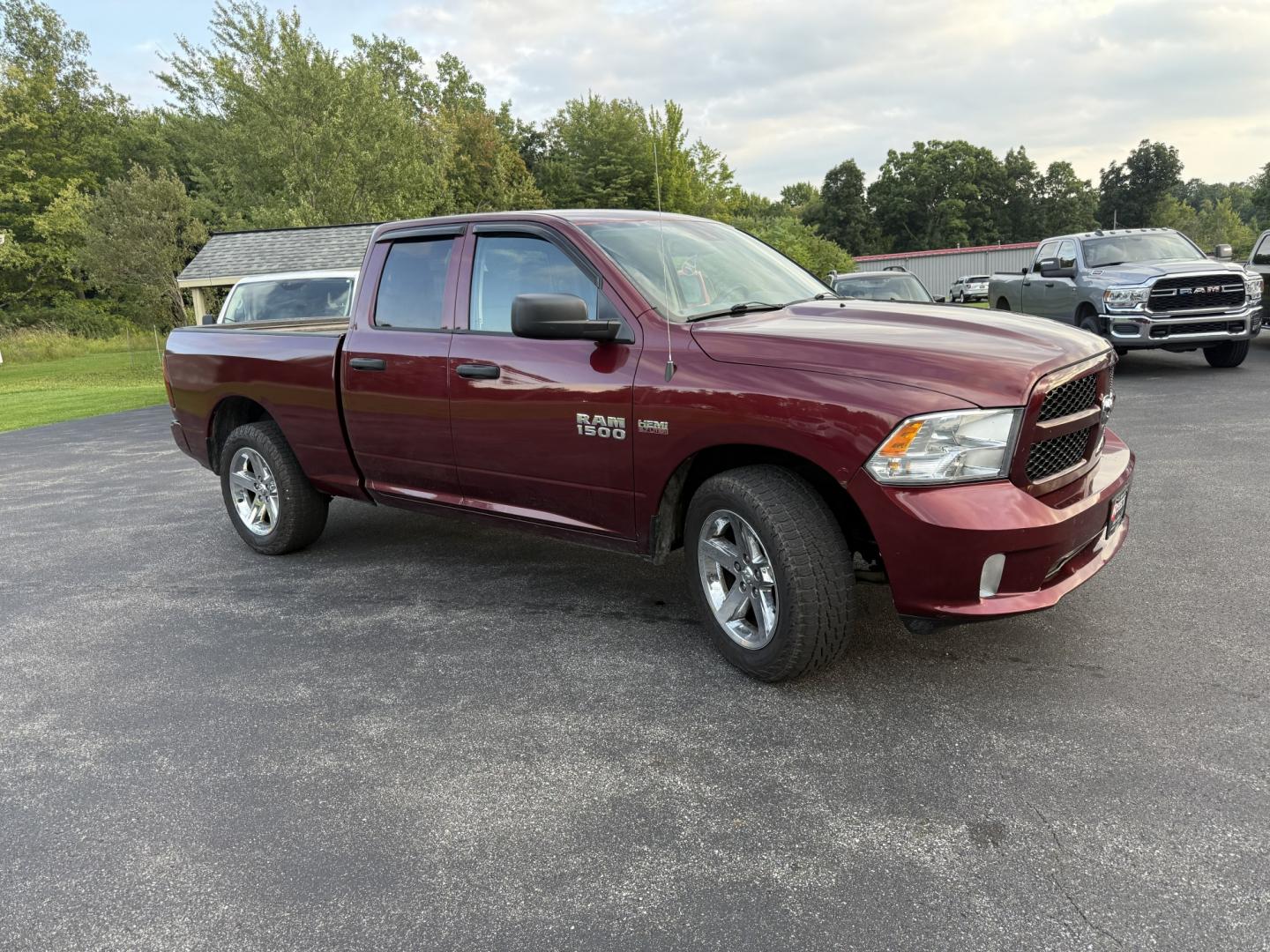 2016 Red /Black RAM 1500 Express Quad Cab 4WD (1C6RR7FT7GS) with an 5.7L V8 OHV 16V engine, Automatic transmission, located at 11115 Chardon Rd. , Chardon, OH, 44024, (440) 214-9705, 41.580246, -81.241943 - 2016 Ram 1500 Express Quad Cab 4WD – HEMI Power with Fresh Brakes and Solid Towing Capability If you need a full-size truck that is straightforward, capable, and ready to work, this 2016 Ram 1500 Express Quad Cab 4WD is a strong option. The 5.7L HEMI V8 and 8-speed automatic deliver dependable po- Photo#3