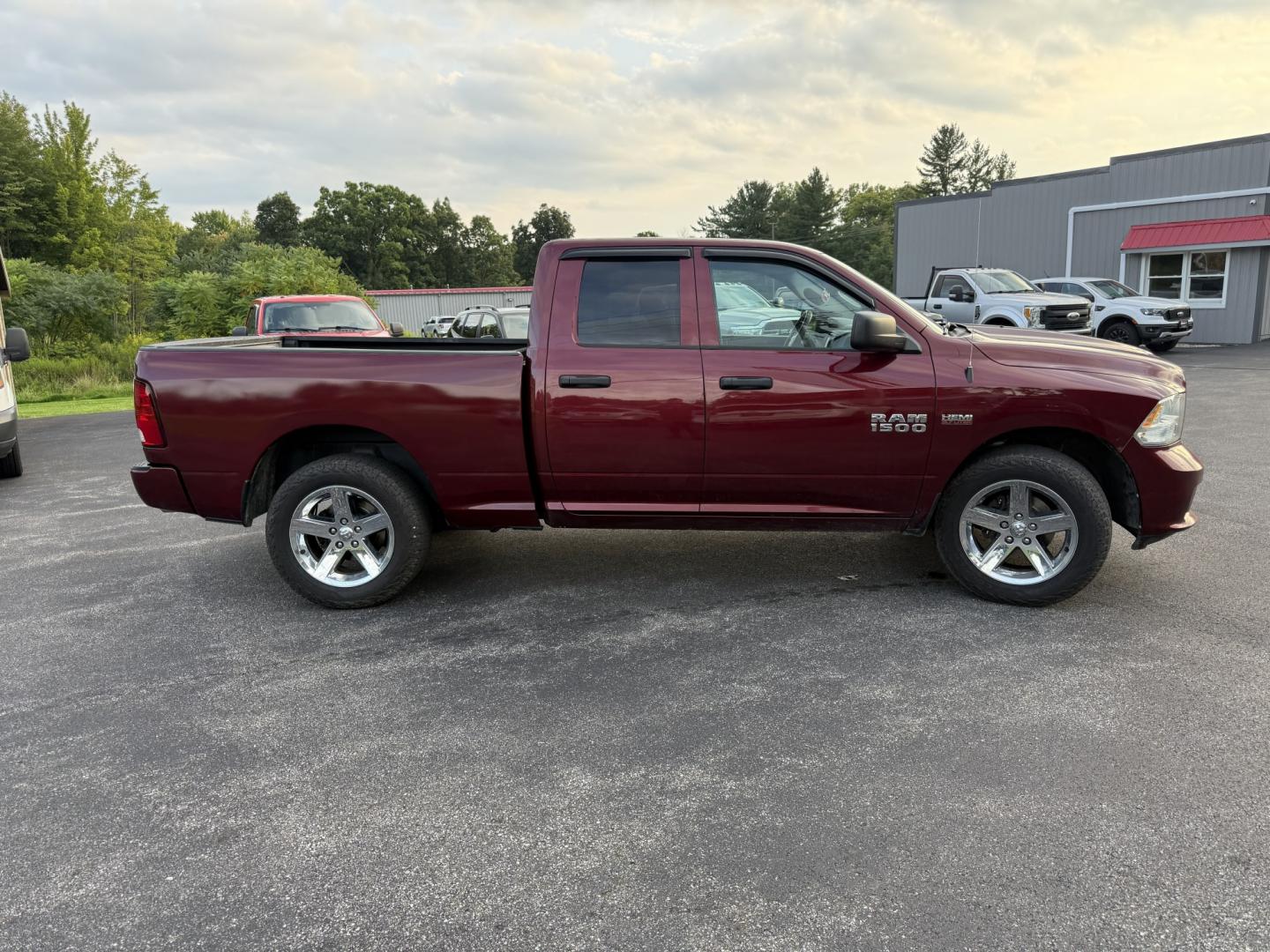 2016 Red /Black RAM 1500 Express Quad Cab 4WD (1C6RR7FT7GS) with an 5.7L V8 OHV 16V engine, Automatic transmission, located at 11115 Chardon Rd. , Chardon, OH, 44024, (440) 214-9705, 41.580246, -81.241943 - 2016 Ram 1500 Express Quad Cab 4WD – HEMI Power with Fresh Brakes and Solid Towing Capability If you need a full-size truck that is straightforward, capable, and ready to work, this 2016 Ram 1500 Express Quad Cab 4WD is a strong option. The 5.7L HEMI V8 and 8-speed automatic deliver dependable po- Photo#6
