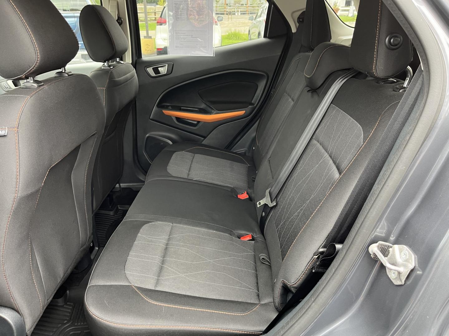 2021 Gray /Black Ford EcoSport SE AWD (MAJ6S3GLXMC) with an 2.0L I4 DOHC 16V engine, Automatc transmission, located at 11115 Chardon Rd. , Chardon, OH, 44024, (440) 214-9705, 41.580246, -81.241943 - 2021 Ford EcoSport SE 4WD – Compact Convenience with All-Weather Capability and One-Owner History If you want a smaller SUV that is easy to park and still useful year-round, this 2021 Ford EcoSport SE 4WD is a practical choice. The 2.0L Duratec engine and 6-speed automatic deliver smooth everyday- Photo#31