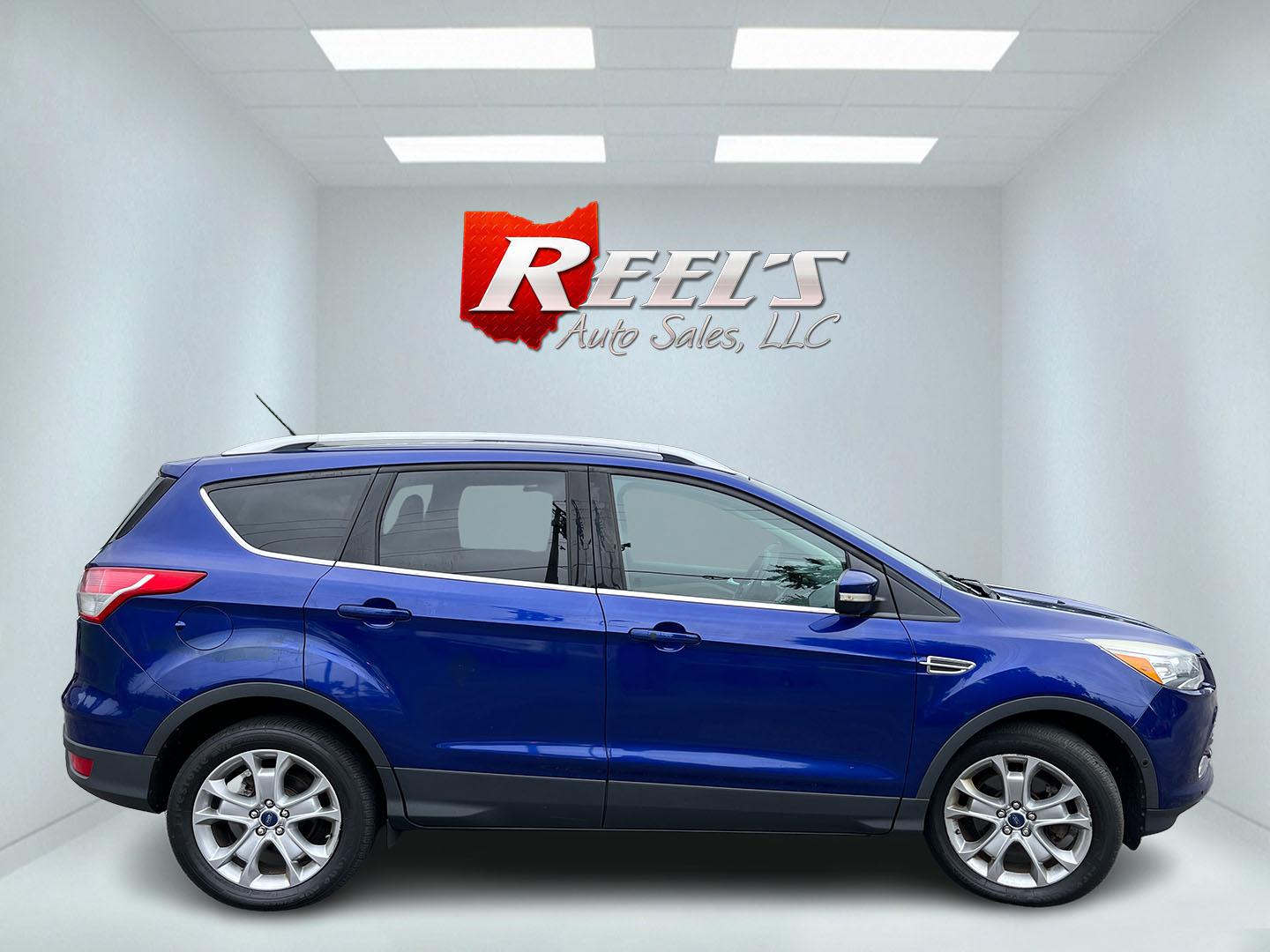 2016 Blue /Gray Ford Escape Titanium 4WD (1FMCU9JX3GU) with an 1.6L I4 DOHC 16V TURBO engine, Automatc transmission, located at 11115 Chardon Rd. , Chardon, OH, 44024, (440) 214-9705, 41.580246, -81.241943 - 2016 Ford Escape Titanium 4WD – Premium Compact SUV with Comfort and Everyday Convenience If you want a compact SUV that feels a step above a base model, this 2016 Ford Escape Titanium 4WD is a strong option. The 1.6L Turbocharged EcoBoost engine and 6-speed automatic deliver responsive power and- Photo#6