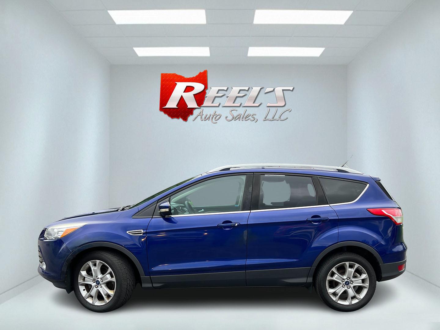 2016 Blue /Gray Ford Escape Titanium 4WD (1FMCU9JX3GU) with an 1.6L I4 DOHC 16V TURBO engine, Automatc transmission, located at 11115 Chardon Rd. , Chardon, OH, 44024, (440) 214-9705, 41.580246, -81.241943 - 2016 Ford Escape Titanium 4WD – Premium Compact SUV with Comfort and Everyday Convenience If you want a compact SUV that feels a step above a base model, this 2016 Ford Escape Titanium 4WD is a strong option. The 1.6L Turbocharged EcoBoost engine and 6-speed automatic deliver responsive power and- Photo#12