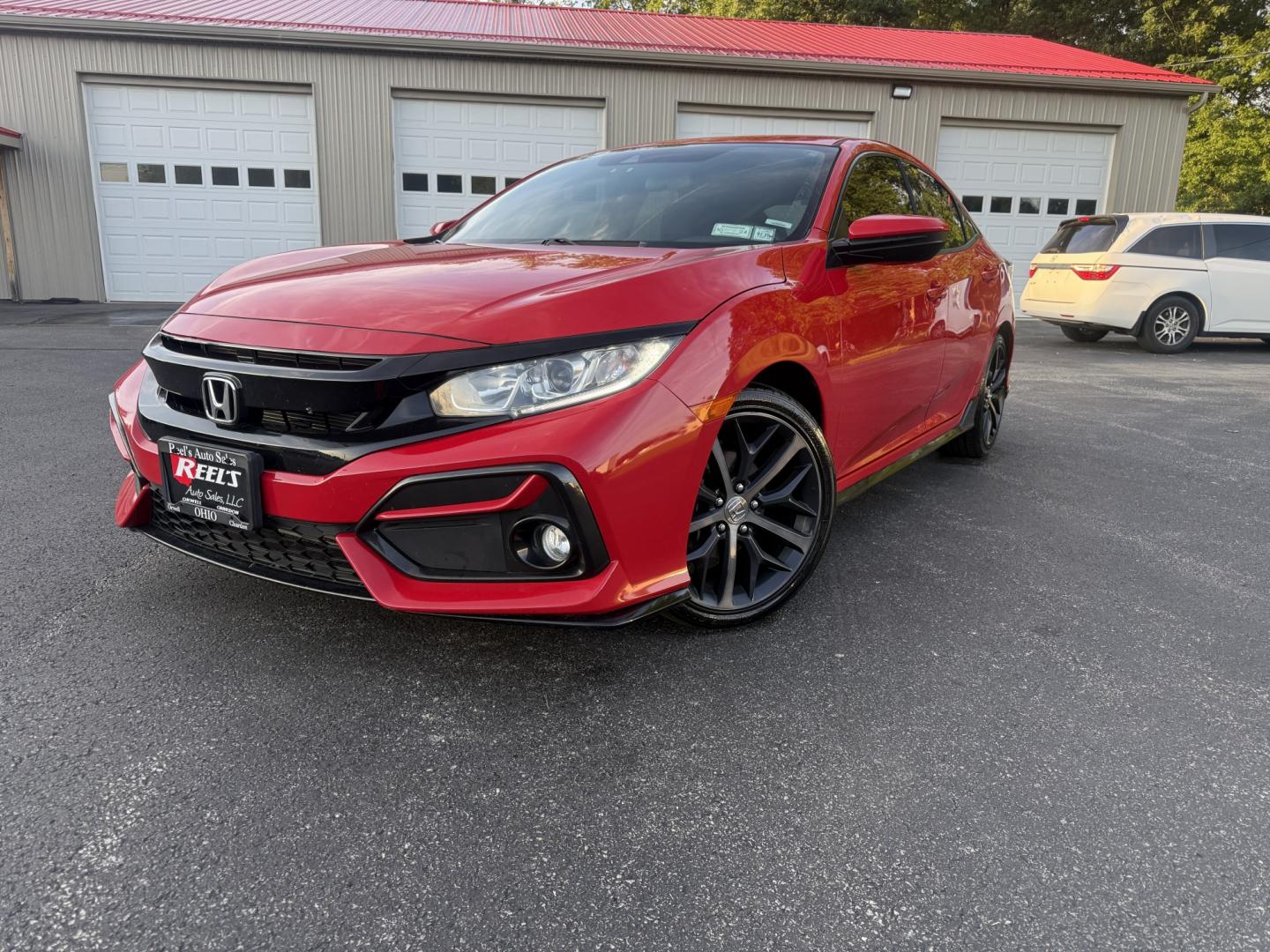 2021 Red /Black Honda Civic Sport Hatchback CVT (SHHFK7H42MU) with an 1.5L I4 16V DOHC TURBO engine, Automatic transmission, located at 547 E. Main St., Orwell, OH, 44076, (440) 437-5893, 41.535435, -80.847855 - 2021 Honda Civic Hatchback Sport – Efficient, Sporty, and Easy to Live With If you want a compact hatchback that feels current, efficient, and enjoyable to drive, this 2021 Honda Civic Hatchback Sport is a strong option. The 1.5L Turbocharged engine delivers responsive power and an impressive 40- Photo#0