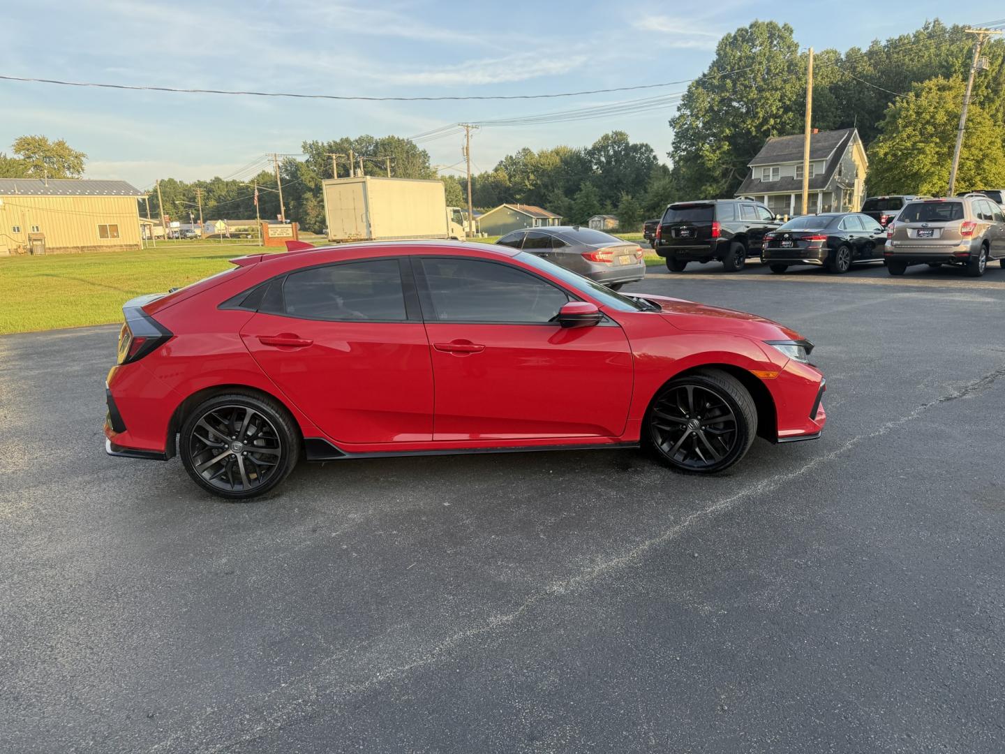 2021 Red /Black Honda Civic Sport Hatchback CVT (SHHFK7H42MU) with an 1.5L I4 16V DOHC TURBO engine, Automatic transmission, located at 547 E. Main St., Orwell, OH, 44076, (440) 437-5893, 41.535435, -80.847855 - 2021 Honda Civic Hatchback Sport – Efficient, Sporty, and Easy to Live With If you want a compact hatchback that feels current, efficient, and enjoyable to drive, this 2021 Honda Civic Hatchback Sport is a strong option. The 1.5L Turbocharged engine delivers responsive power and an impressive 40- Photo#19