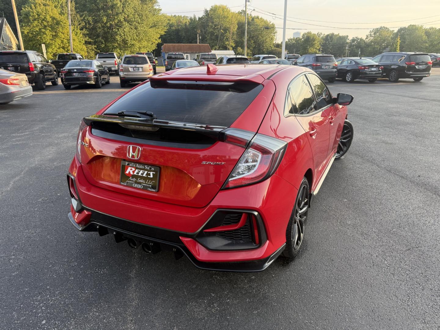 2021 Red /Black Honda Civic Sport Hatchback CVT (SHHFK7H42MU) with an 1.5L I4 16V DOHC TURBO engine, Automatic transmission, located at 547 E. Main St., Orwell, OH, 44076, (440) 437-5893, 41.535435, -80.847855 - 2021 Honda Civic Hatchback Sport – Efficient, Sporty, and Easy to Live With If you want a compact hatchback that feels current, efficient, and enjoyable to drive, this 2021 Honda Civic Hatchback Sport is a strong option. The 1.5L Turbocharged engine delivers responsive power and an impressive 40- Photo#21