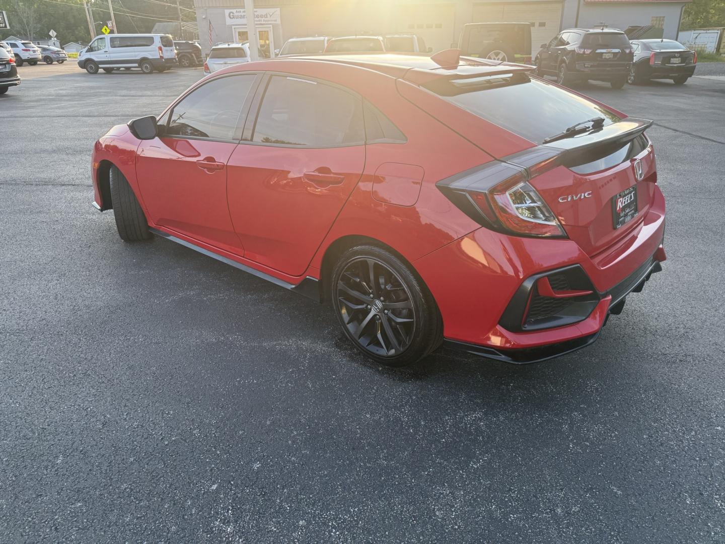 2021 Red /Black Honda Civic Sport Hatchback CVT (SHHFK7H42MU) with an 1.5L I4 16V DOHC TURBO engine, Automatic transmission, located at 547 E. Main St., Orwell, OH, 44076, (440) 437-5893, 41.535435, -80.847855 - 2021 Honda Civic Hatchback Sport – Efficient, Sporty, and Easy to Live With If you want a compact hatchback that feels current, efficient, and enjoyable to drive, this 2021 Honda Civic Hatchback Sport is a strong option. The 1.5L Turbocharged engine delivers responsive power and an impressive 40- Photo#23