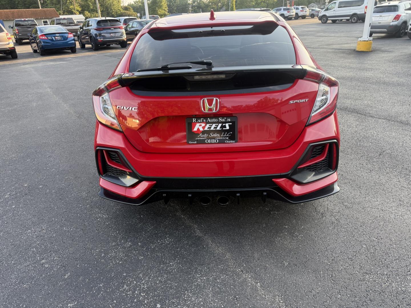 2021 Red /Black Honda Civic Sport Hatchback CVT (SHHFK7H42MU) with an 1.5L I4 16V DOHC TURBO engine, Automatic transmission, located at 547 E. Main St., Orwell, OH, 44076, (440) 437-5893, 41.535435, -80.847855 - 2021 Honda Civic Hatchback Sport – Efficient, Sporty, and Easy to Live With If you want a compact hatchback that feels current, efficient, and enjoyable to drive, this 2021 Honda Civic Hatchback Sport is a strong option. The 1.5L Turbocharged engine delivers responsive power and an impressive 40- Photo#22