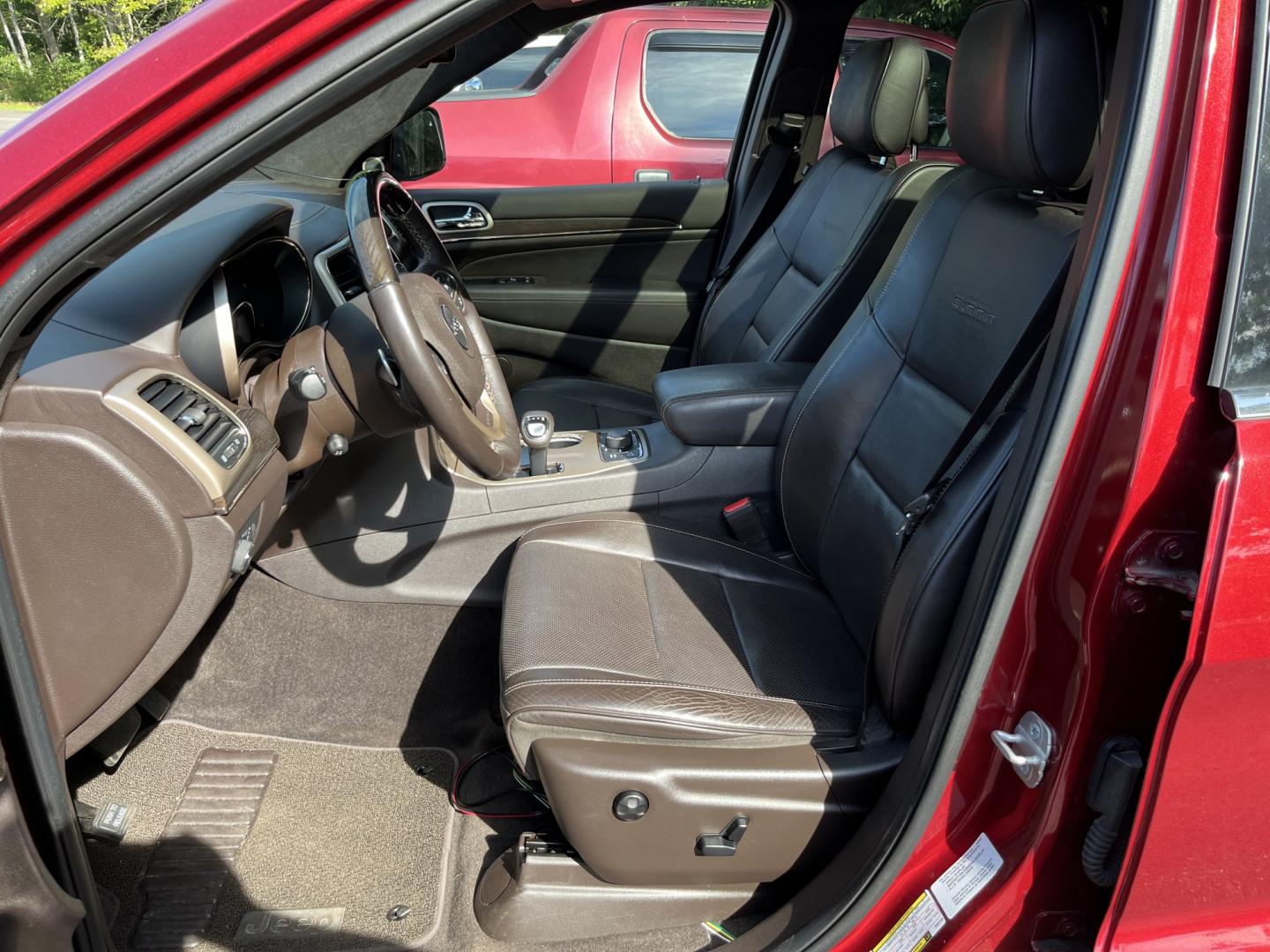 2014 Red /Black Jeep Grand Cherokee Summit 4WD (1C4RJFJT8EC) with an 5.7L V8 OHV 16V engine, Automatic transmission, located at 11115 Chardon Rd. , Chardon, OH, 44024, (440) 214-9705, 41.580246, -81.241943 - 2014 Jeep Grand Cherokee Summit 4WD – Premium HEMI Capability with Low Miles and One-Owner History If you want a luxury SUV that can still tow and handle changing conditions, this 2014 Jeep Grand Cherokee Summit 4WD is a standout. The 5.7L HEMI V8 and 8-speed automatic deliver strong power and a- Photo#16