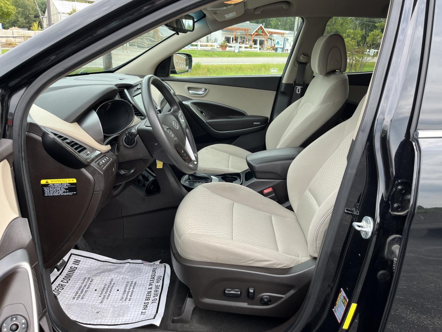 2017 Black /Tan Hyundai Santa Fe Sport 2.4 AWD (5NMZUDLB8HH) with an 2.4L I4 DOHC 16V engine, Automatc transmission, located at 11115 Chardon Rd. , Chardon, OH, 44024, (440) 214-9705, 41.580246, -81.241943 - 2017 Hyundai Santa Fe Sport AWD – Everyday Space with All-Weather Confidence Looking for a midsize SUV that stays useful without becoming complicated? This 2017 Hyundai Santa Fe Sport AWD is built for that kind of driving. The 2.4L GDI engine and 6-speed automatic give you smooth, dependable powe- Photo#17