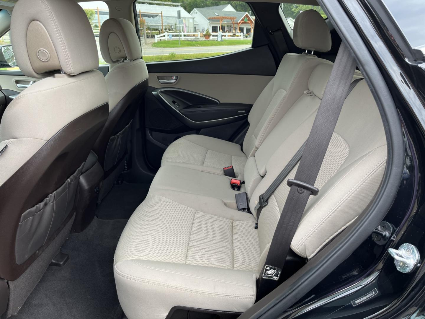 2017 Black /Tan Hyundai Santa Fe Sport 2.4 AWD (5NMZUDLB8HH) with an 2.4L I4 DOHC 16V engine, Automatc transmission, located at 11115 Chardon Rd. , Chardon, OH, 44024, (440) 214-9705, 41.580246, -81.241943 - 2017 Hyundai Santa Fe Sport AWD – Everyday Space with All-Weather Confidence Looking for a midsize SUV that stays useful without becoming complicated? This 2017 Hyundai Santa Fe Sport AWD is built for that kind of driving. The 2.4L GDI engine and 6-speed automatic give you smooth, dependable powe- Photo#29