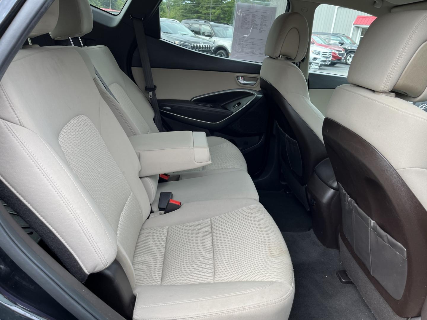 2017 Black /Tan Hyundai Santa Fe Sport 2.4 AWD (5NMZUDLB8HH) with an 2.4L I4 DOHC 16V engine, Automatc transmission, located at 11115 Chardon Rd. , Chardon, OH, 44024, (440) 214-9705, 41.580246, -81.241943 - 2017 Hyundai Santa Fe Sport AWD – Everyday Space with All-Weather Confidence Looking for a midsize SUV that stays useful without becoming complicated? This 2017 Hyundai Santa Fe Sport AWD is built for that kind of driving. The 2.4L GDI engine and 6-speed automatic give you smooth, dependable powe- Photo#32