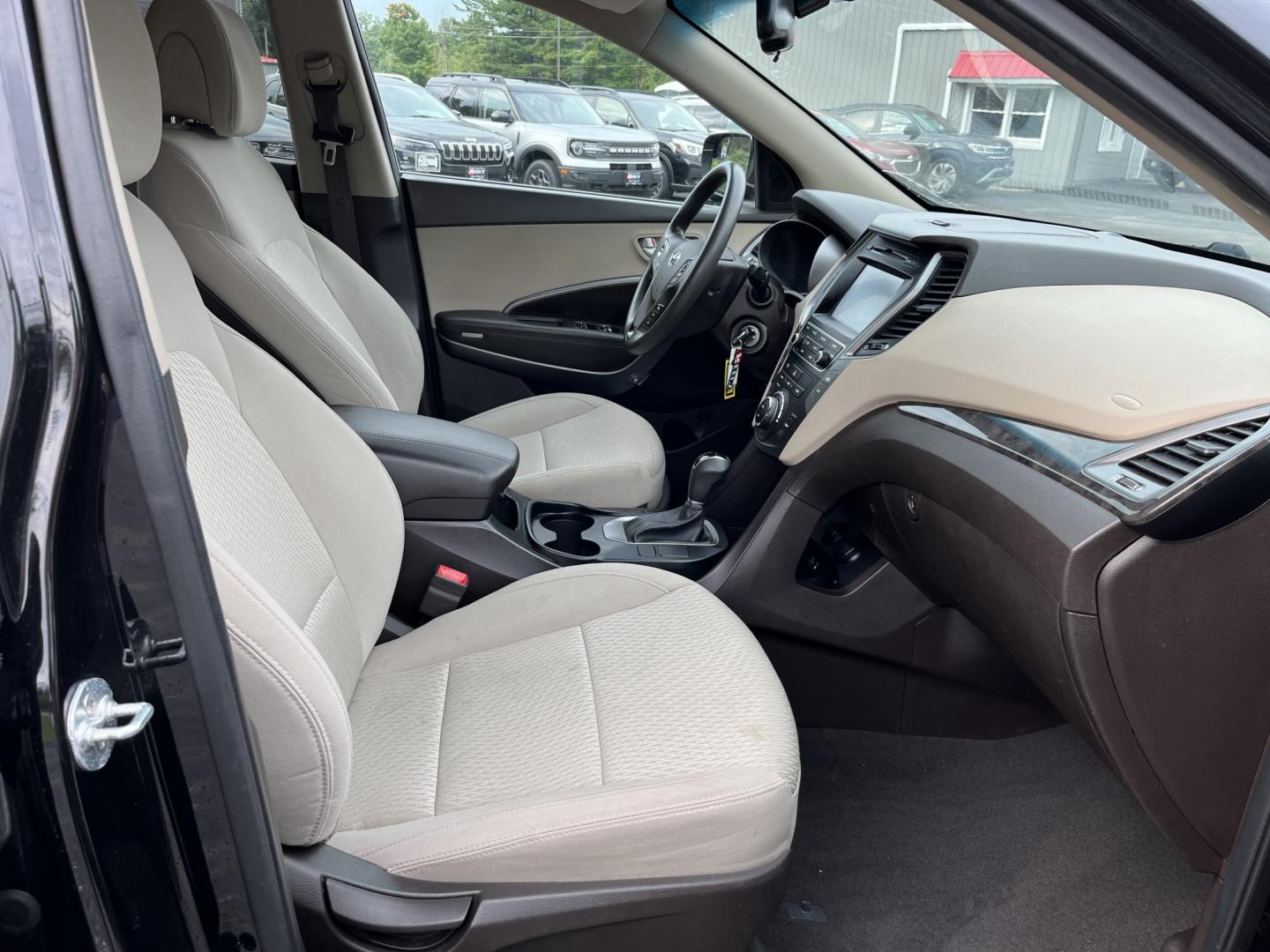 2017 Black /Tan Hyundai Santa Fe Sport 2.4 AWD (5NMZUDLB8HH) with an 2.4L I4 DOHC 16V engine, Automatc transmission, located at 11115 Chardon Rd. , Chardon, OH, 44024, (440) 214-9705, 41.580246, -81.241943 - 2017 Hyundai Santa Fe Sport AWD – Everyday Space with All-Weather Confidence Looking for a midsize SUV that stays useful without becoming complicated? This 2017 Hyundai Santa Fe Sport AWD is built for that kind of driving. The 2.4L GDI engine and 6-speed automatic give you smooth, dependable powe- Photo#34