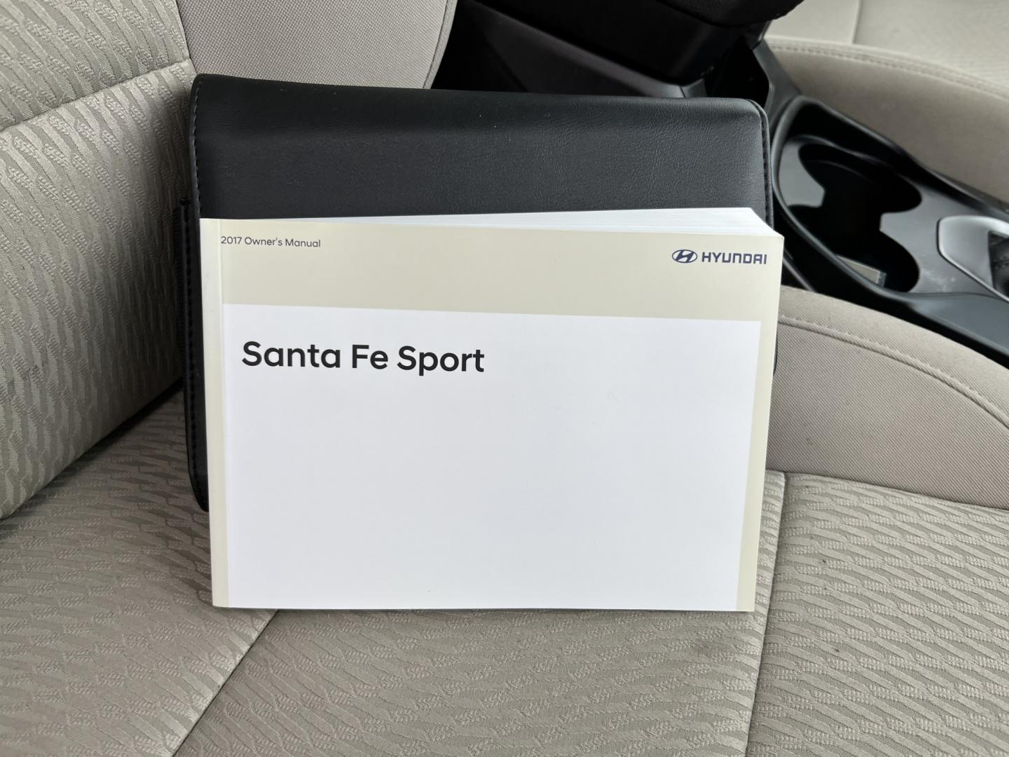 2017 Black /Tan Hyundai Santa Fe Sport 2.4 AWD (5NMZUDLB8HH) with an 2.4L I4 DOHC 16V engine, Automatc transmission, located at 11115 Chardon Rd. , Chardon, OH, 44024, (440) 214-9705, 41.580246, -81.241943 - 2017 Hyundai Santa Fe Sport AWD – Everyday Space with All-Weather Confidence Looking for a midsize SUV that stays useful without becoming complicated? This 2017 Hyundai Santa Fe Sport AWD is built for that kind of driving. The 2.4L GDI engine and 6-speed automatic give you smooth, dependable powe- Photo#37