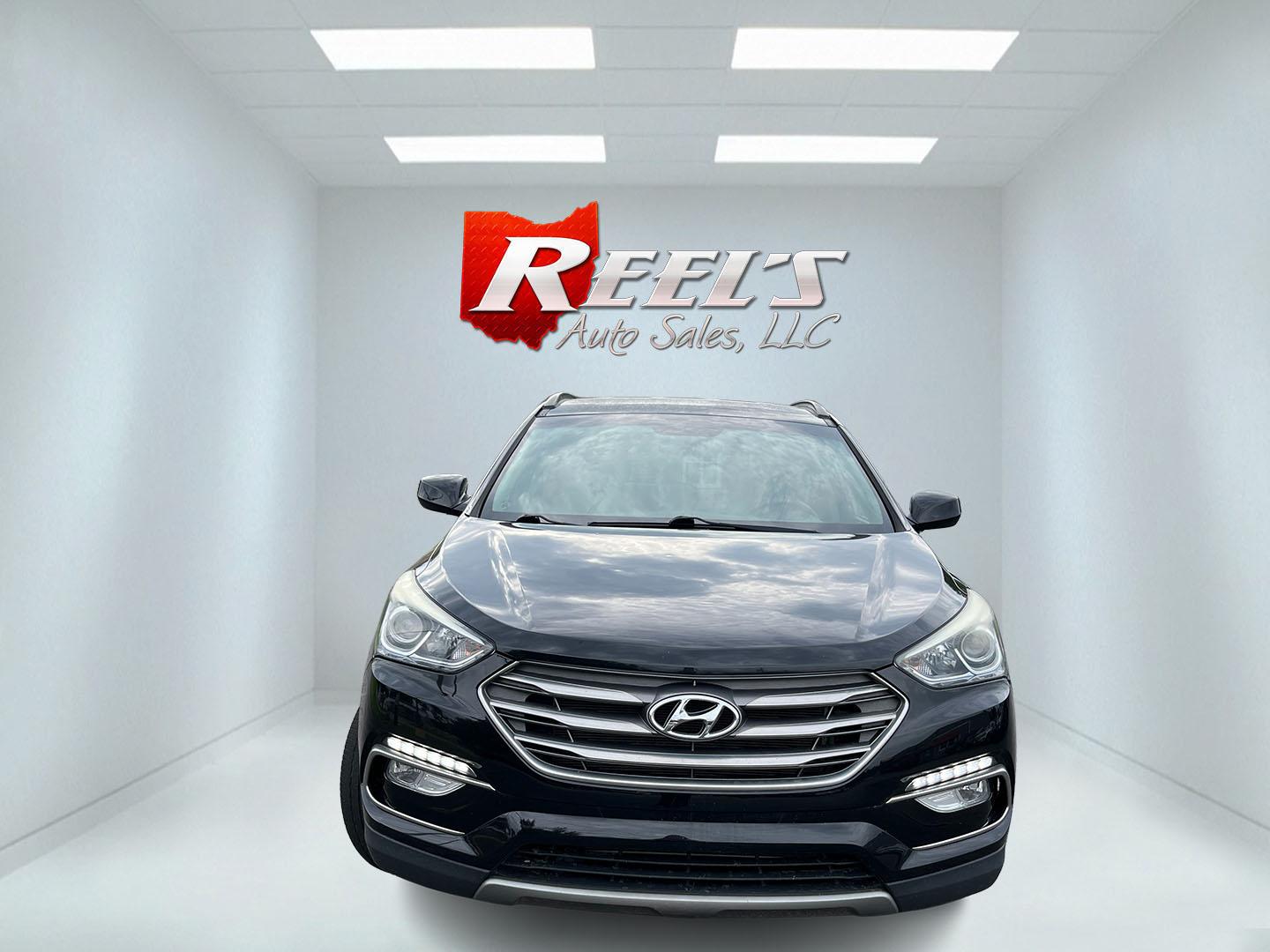 2017 Black /Tan Hyundai Santa Fe Sport 2.4 AWD (5NMZUDLB8HH) with an 2.4L I4 DOHC 16V engine, Automatc transmission, located at 11115 Chardon Rd. , Chardon, OH, 44024, (440) 214-9705, 41.580246, -81.241943 - 2017 Hyundai Santa Fe Sport AWD – Everyday Space with All-Weather Confidence Looking for a midsize SUV that stays useful without becoming complicated? This 2017 Hyundai Santa Fe Sport AWD is built for that kind of driving. The 2.4L GDI engine and 6-speed automatic give you smooth, dependable powe- Photo#1