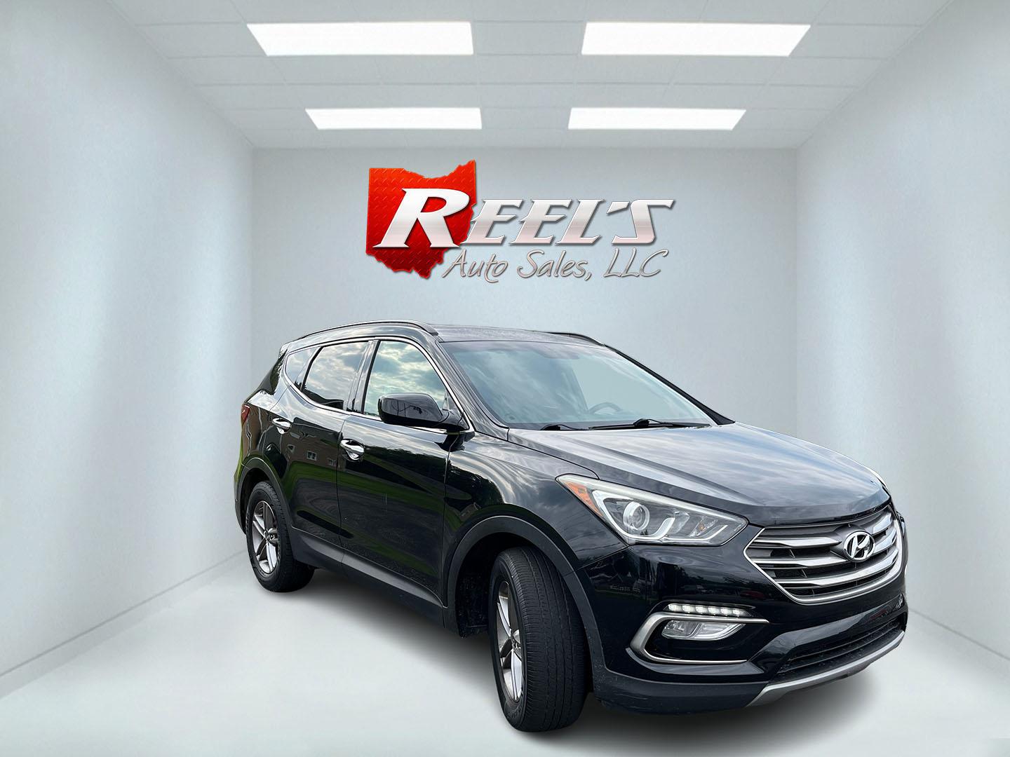 2017 Black /Tan Hyundai Santa Fe Sport 2.4 AWD (5NMZUDLB8HH) with an 2.4L I4 DOHC 16V engine, Automatc transmission, located at 11115 Chardon Rd. , Chardon, OH, 44024, (440) 214-9705, 41.580246, -81.241943 - 2017 Hyundai Santa Fe Sport AWD – Everyday Space with All-Weather Confidence Looking for a midsize SUV that stays useful without becoming complicated? This 2017 Hyundai Santa Fe Sport AWD is built for that kind of driving. The 2.4L GDI engine and 6-speed automatic give you smooth, dependable powe- Photo#2
