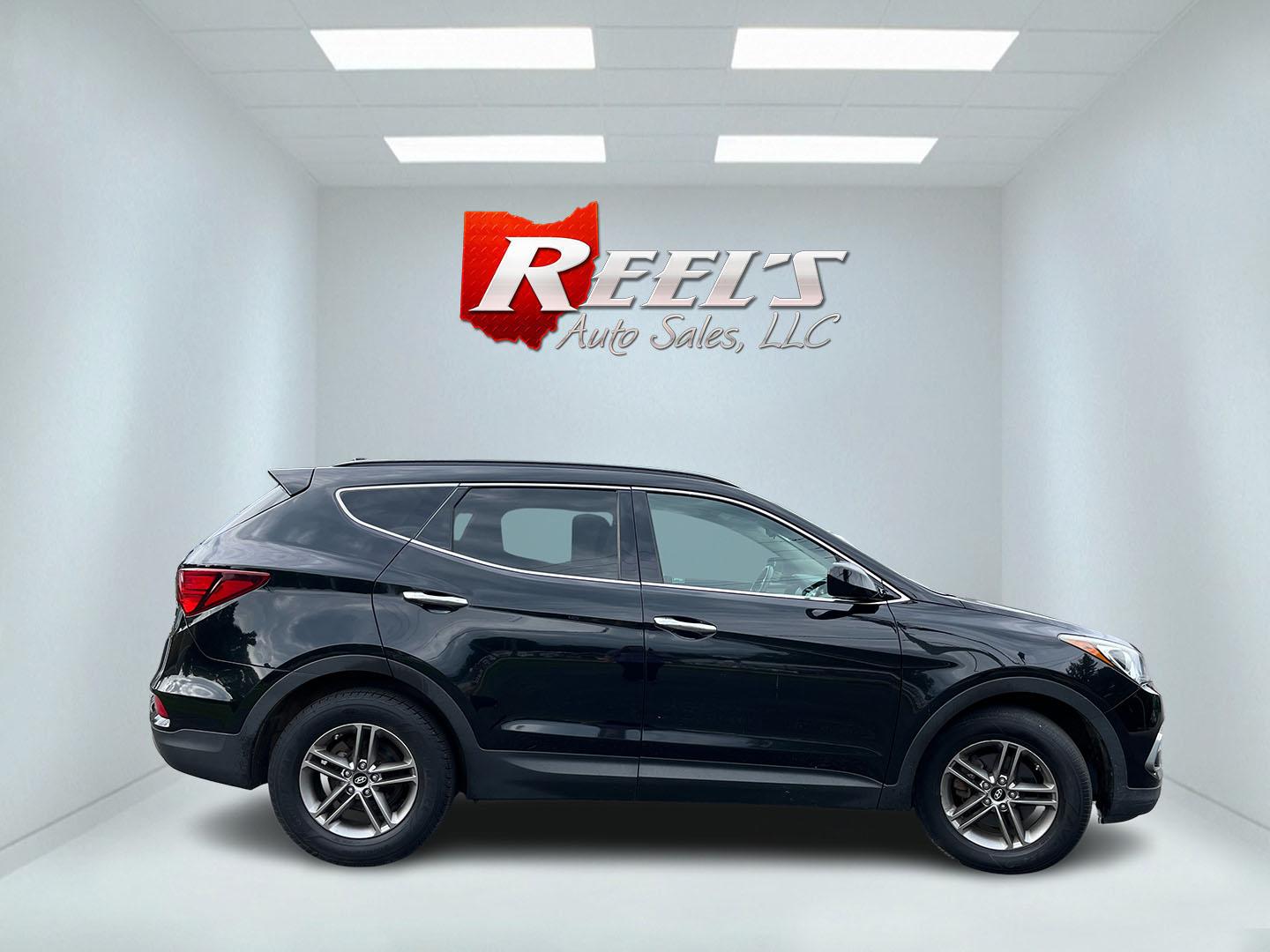 2017 Black /Tan Hyundai Santa Fe Sport 2.4 AWD (5NMZUDLB8HH) with an 2.4L I4 DOHC 16V engine, Automatc transmission, located at 11115 Chardon Rd. , Chardon, OH, 44024, (440) 214-9705, 41.580246, -81.241943 - 2017 Hyundai Santa Fe Sport AWD – Everyday Space with All-Weather Confidence Looking for a midsize SUV that stays useful without becoming complicated? This 2017 Hyundai Santa Fe Sport AWD is built for that kind of driving. The 2.4L GDI engine and 6-speed automatic give you smooth, dependable powe- Photo#5