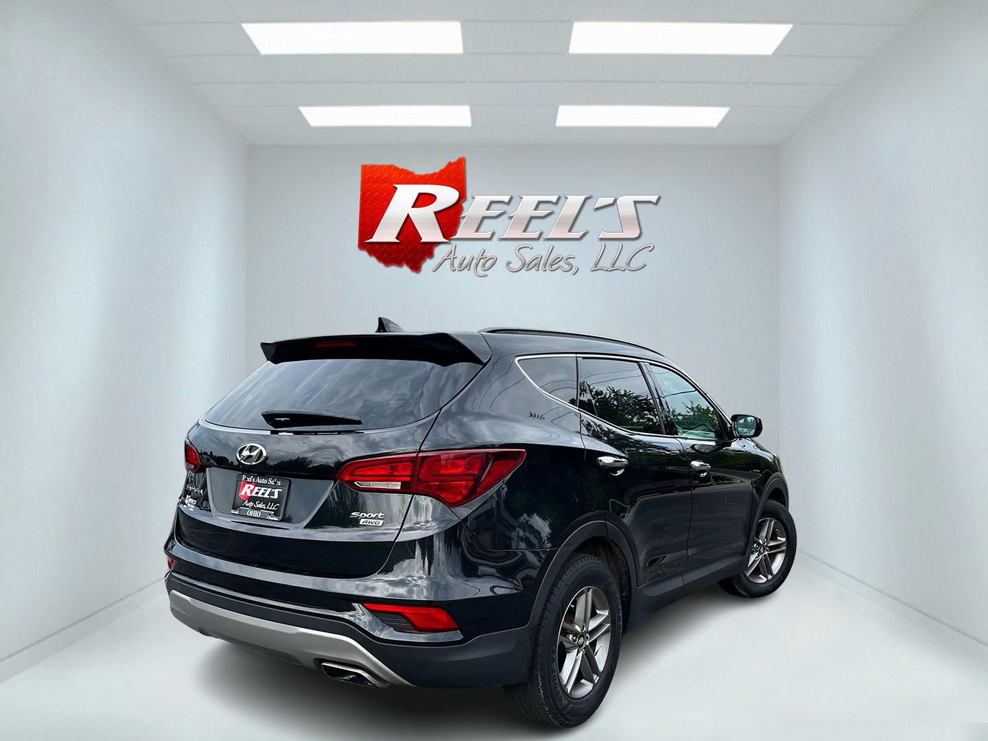 2017 Black /Tan Hyundai Santa Fe Sport 2.4 AWD (5NMZUDLB8HH) with an 2.4L I4 DOHC 16V engine, Automatc transmission, located at 11115 Chardon Rd. , Chardon, OH, 44024, (440) 214-9705, 41.580246, -81.241943 - 2017 Hyundai Santa Fe Sport AWD – Everyday Space with All-Weather Confidence Looking for a midsize SUV that stays useful without becoming complicated? This 2017 Hyundai Santa Fe Sport AWD is built for that kind of driving. The 2.4L GDI engine and 6-speed automatic give you smooth, dependable powe- Photo#6