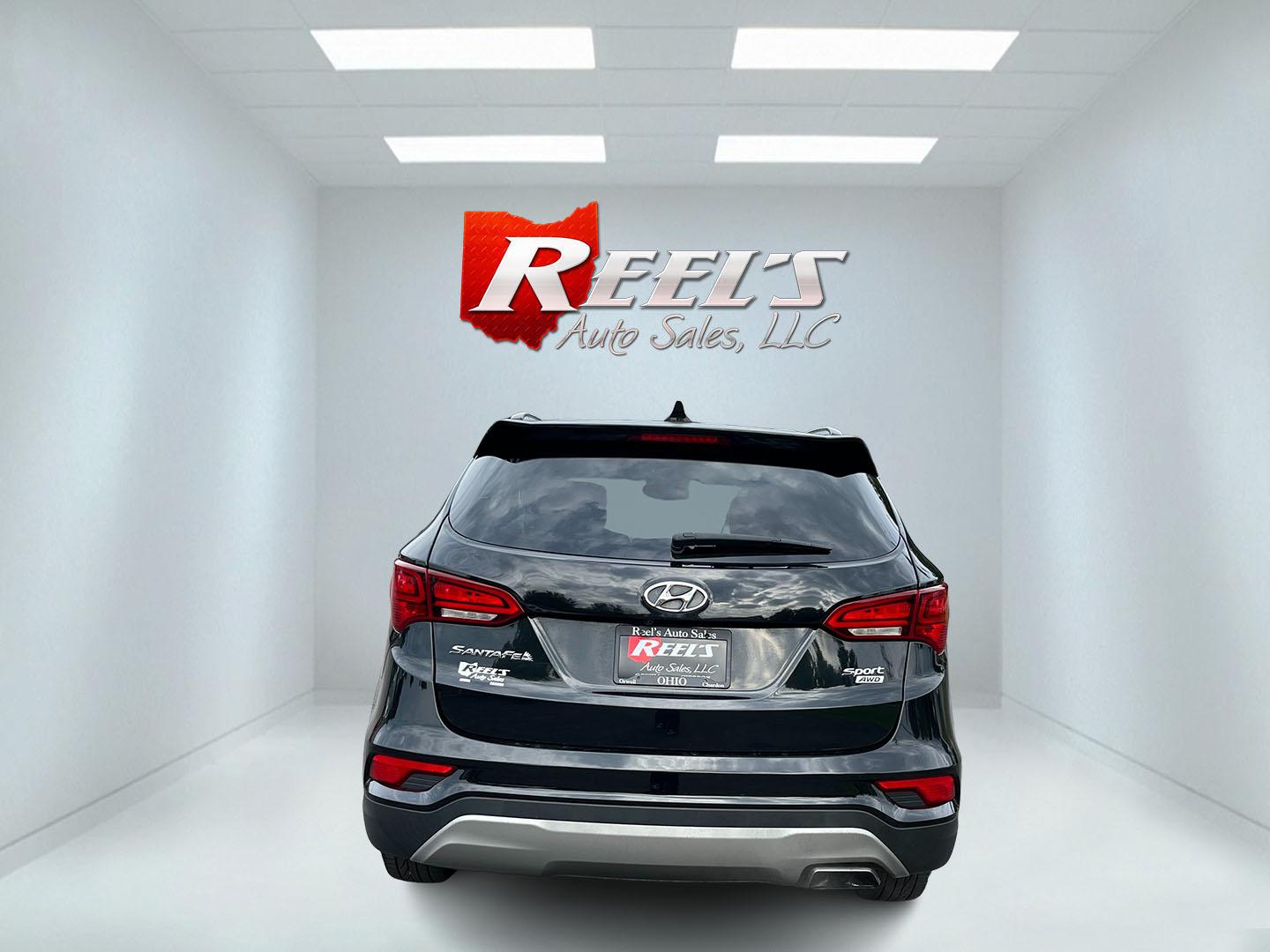 2017 Black /Tan Hyundai Santa Fe Sport 2.4 AWD (5NMZUDLB8HH) with an 2.4L I4 DOHC 16V engine, Automatc transmission, located at 11115 Chardon Rd. , Chardon, OH, 44024, (440) 214-9705, 41.580246, -81.241943 - 2017 Hyundai Santa Fe Sport AWD – Everyday Space with All-Weather Confidence Looking for a midsize SUV that stays useful without becoming complicated? This 2017 Hyundai Santa Fe Sport AWD is built for that kind of driving. The 2.4L GDI engine and 6-speed automatic give you smooth, dependable powe- Photo#8
