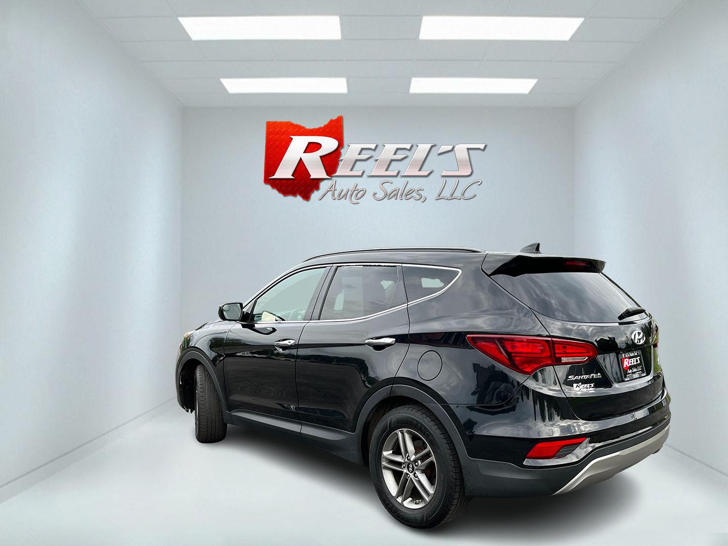 2017 Black /Tan Hyundai Santa Fe Sport 2.4 AWD (5NMZUDLB8HH) with an 2.4L I4 DOHC 16V engine, Automatc transmission, located at 11115 Chardon Rd. , Chardon, OH, 44024, (440) 214-9705, 41.580246, -81.241943 - 2017 Hyundai Santa Fe Sport AWD – Everyday Space with All-Weather Confidence Looking for a midsize SUV that stays useful without becoming complicated? This 2017 Hyundai Santa Fe Sport AWD is built for that kind of driving. The 2.4L GDI engine and 6-speed automatic give you smooth, dependable powe- Photo#9