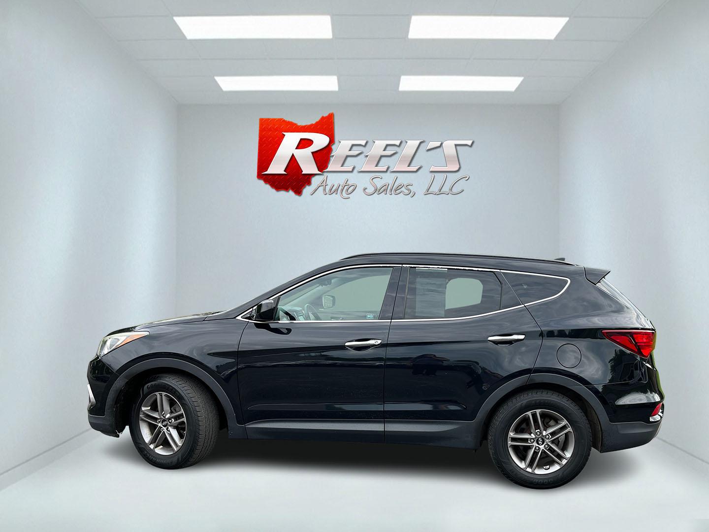 2017 Black /Tan Hyundai Santa Fe Sport 2.4 AWD (5NMZUDLB8HH) with an 2.4L I4 DOHC 16V engine, Automatc transmission, located at 11115 Chardon Rd. , Chardon, OH, 44024, (440) 214-9705, 41.580246, -81.241943 - 2017 Hyundai Santa Fe Sport AWD – Everyday Space with All-Weather Confidence Looking for a midsize SUV that stays useful without becoming complicated? This 2017 Hyundai Santa Fe Sport AWD is built for that kind of driving. The 2.4L GDI engine and 6-speed automatic give you smooth, dependable powe- Photo#11