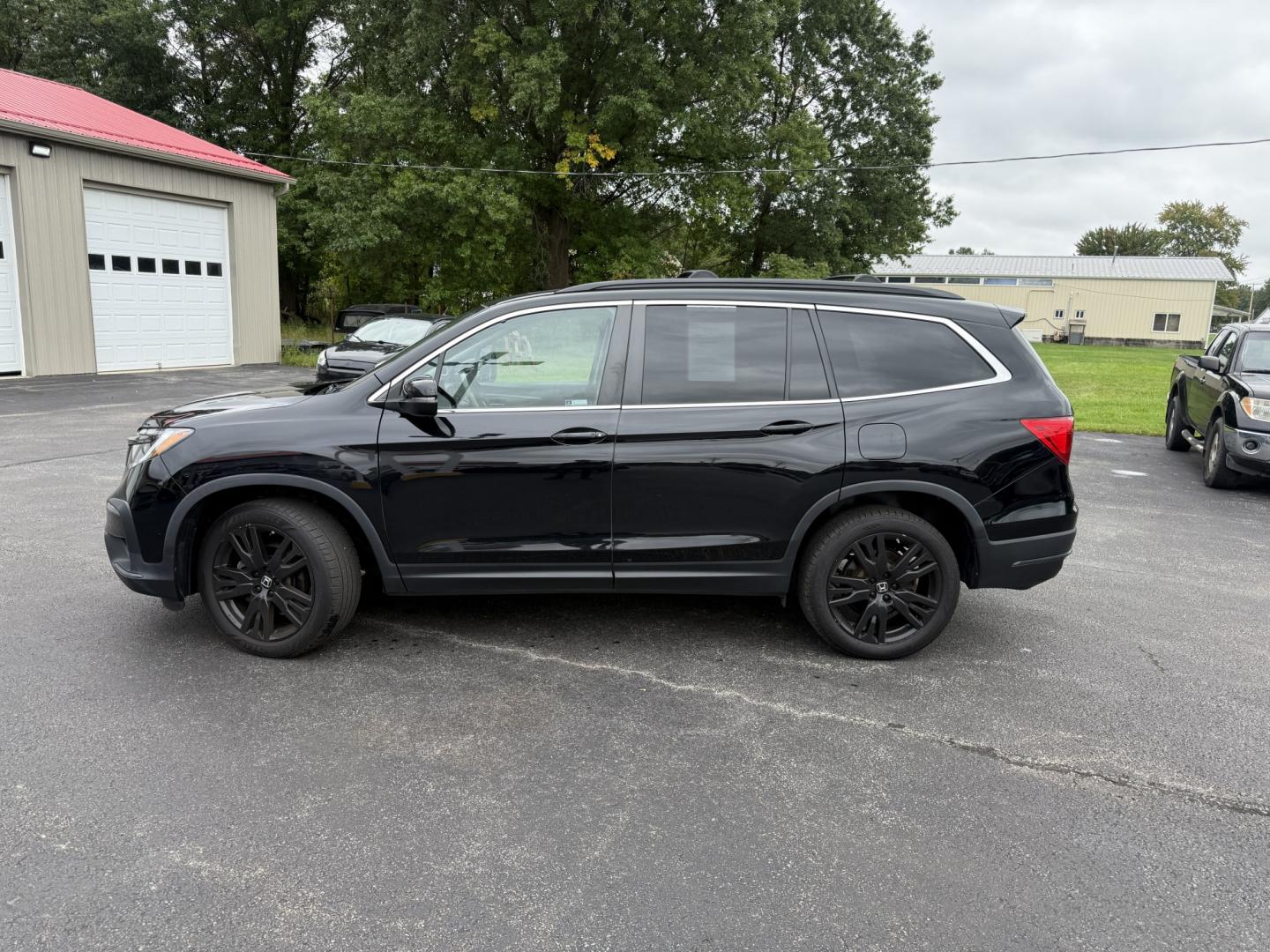 2022 Black /Black Honda Pilot SE 4WD (5FNYF6H21NB) with an 3.5L V6 SOHC 24V engine, Automatic transmission, located at 547 E. Main St., Orwell, OH, 44076, (440) 437-5893, 41.535435, -80.847855 - 2022 Honda Pilot SE AWD – Family-Ready Three-Row Honda with Comfort and Confidence If you need room for the family and the peace of mind of Honda reliability, this 2022 Honda Pilot SE AWD is a strong choice. Finished in Crystal Black Pearl and riding on 20" black alloy wheels, with LED daytime ru- Photo#35