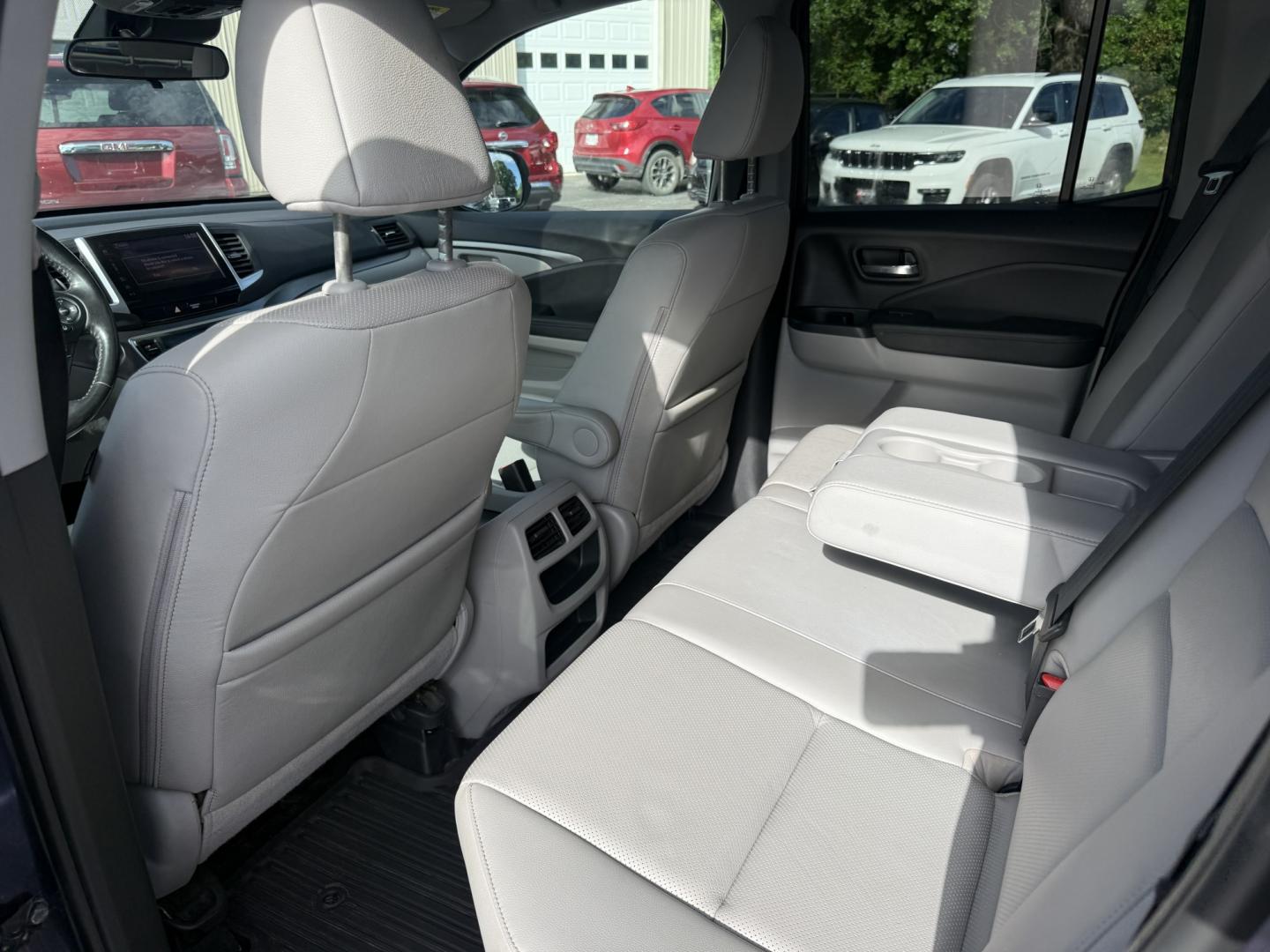 2020 Blue /Gray Honda Ridgeline RTL AWD (5FPYK3F51LB) with an 3.5L V6 SOHC 24V engine, Automatic transmission, located at 11115 Chardon Rd. , Chardon, OH, 44024, (440) 214-9705, 41.580246, -81.241943 - 2020 Honda Ridgeline RTL AWD – Unique Honda Pickup Comfort with Everyday Capability The Ridgeline is Honda’s take on a pickup — more comfortable and car-like than a traditional truck, but still useful when you need a bed and towing. This 2020 RTL AWD is a strong example. Finished in Obsidian- Photo#18
