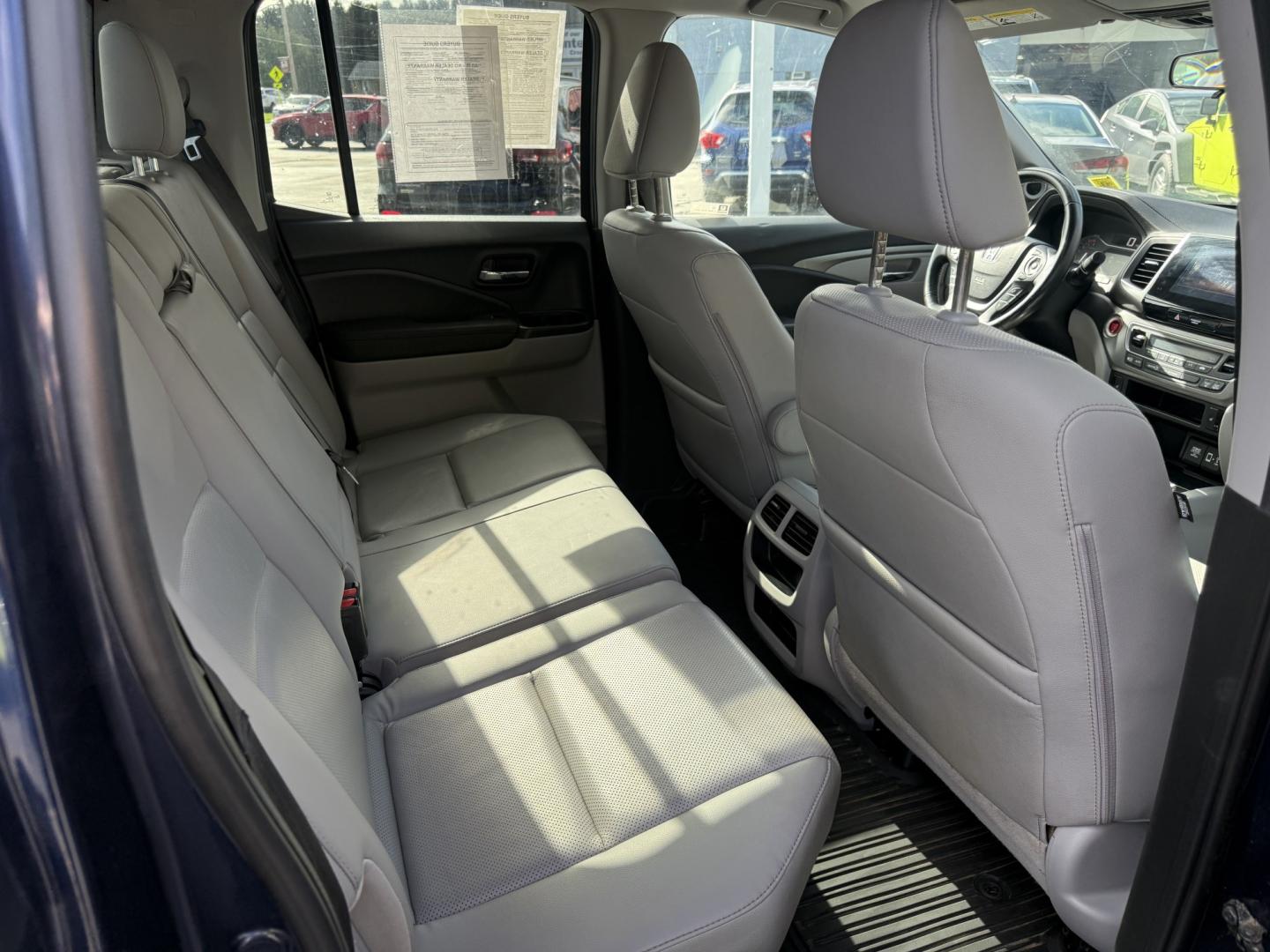 2020 Blue /Gray Honda Ridgeline RTL AWD (5FPYK3F51LB) with an 3.5L V6 SOHC 24V engine, Automatic transmission, located at 11115 Chardon Rd. , Chardon, OH, 44024, (440) 214-9705, 41.580246, -81.241943 - 2020 Honda Ridgeline RTL AWD – Unique Honda Pickup Comfort with Everyday Capability The Ridgeline is Honda’s take on a pickup — more comfortable and car-like than a traditional truck, but still useful when you need a bed and towing. This 2020 RTL AWD is a strong example. Finished in Obsidian- Photo#35