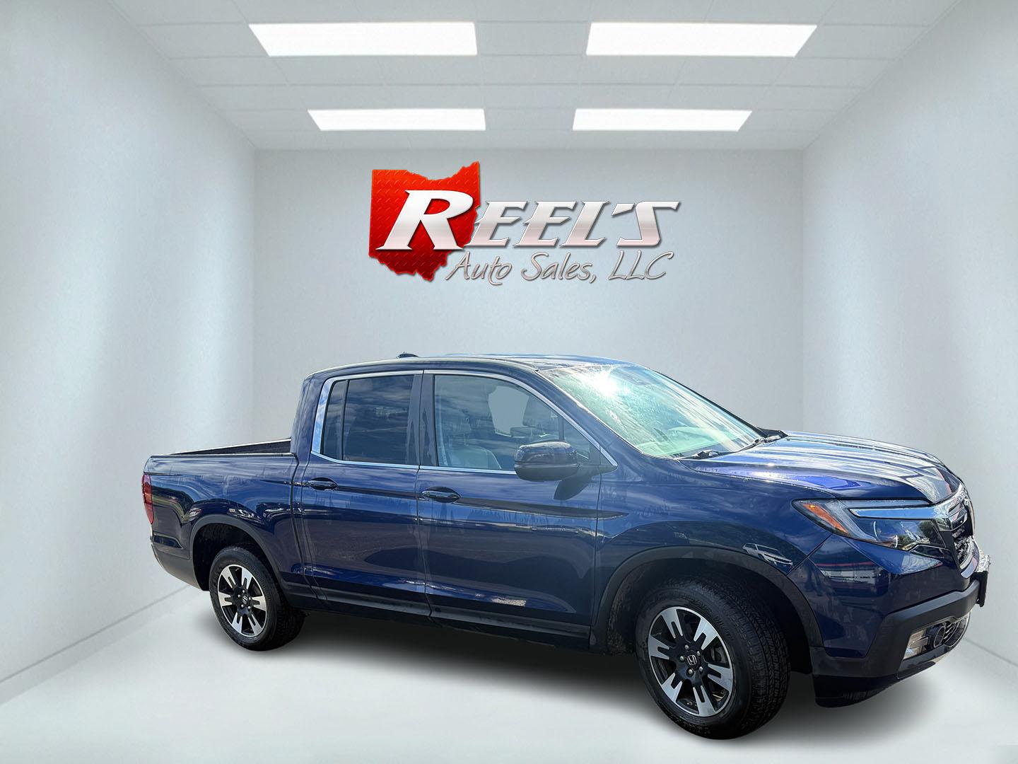 2020 Blue /Gray Honda Ridgeline RTL AWD (5FPYK3F51LB) with an 3.5L V6 SOHC 24V engine, Automatic transmission, located at 11115 Chardon Rd. , Chardon, OH, 44024, (440) 214-9705, 41.580246, -81.241943 - 2020 Honda Ridgeline RTL AWD – Unique Honda Pickup Comfort with Everyday Capability The Ridgeline is Honda’s take on a pickup — more comfortable and car-like than a traditional truck, but still useful when you need a bed and towing. This 2020 RTL AWD is a strong example. Finished in Obsidian- Photo#2