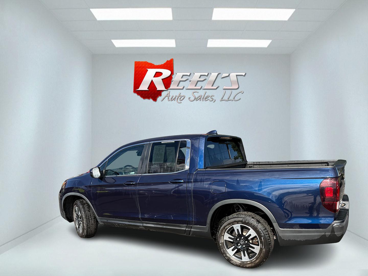 2020 Blue /Gray Honda Ridgeline RTL AWD (5FPYK3F51LB) with an 3.5L V6 SOHC 24V engine, Automatic transmission, located at 11115 Chardon Rd. , Chardon, OH, 44024, (440) 214-9705, 41.580246, -81.241943 - 2020 Honda Ridgeline RTL AWD – Unique Honda Pickup Comfort with Everyday Capability The Ridgeline is Honda’s take on a pickup — more comfortable and car-like than a traditional truck, but still useful when you need a bed and towing. This 2020 RTL AWD is a strong example. Finished in Obsidian- Photo#25